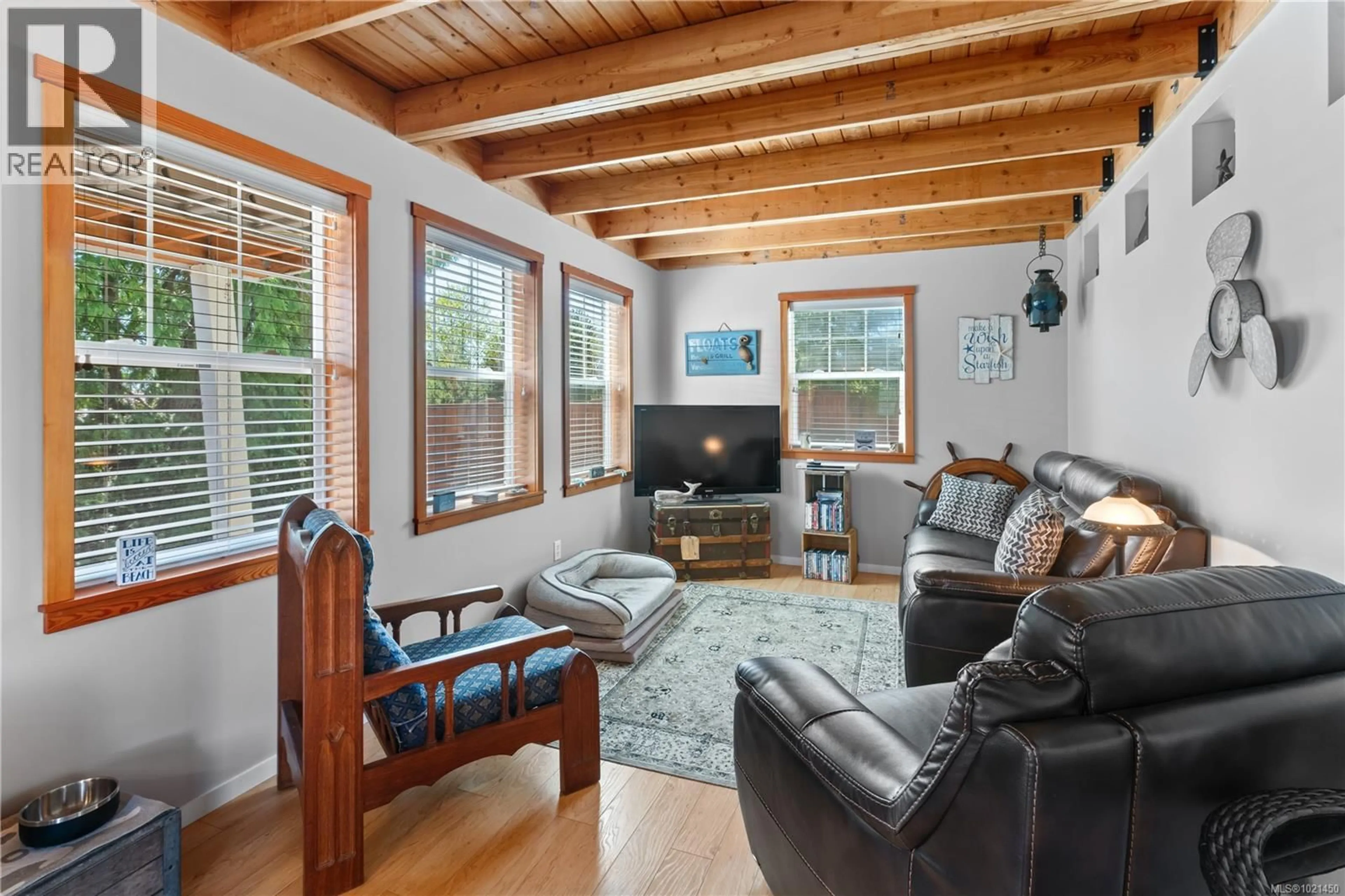 Living room with furniture, wood/laminate floor for 1129 FIFTH AVENUE, Ucluelet British Columbia V0R3A0