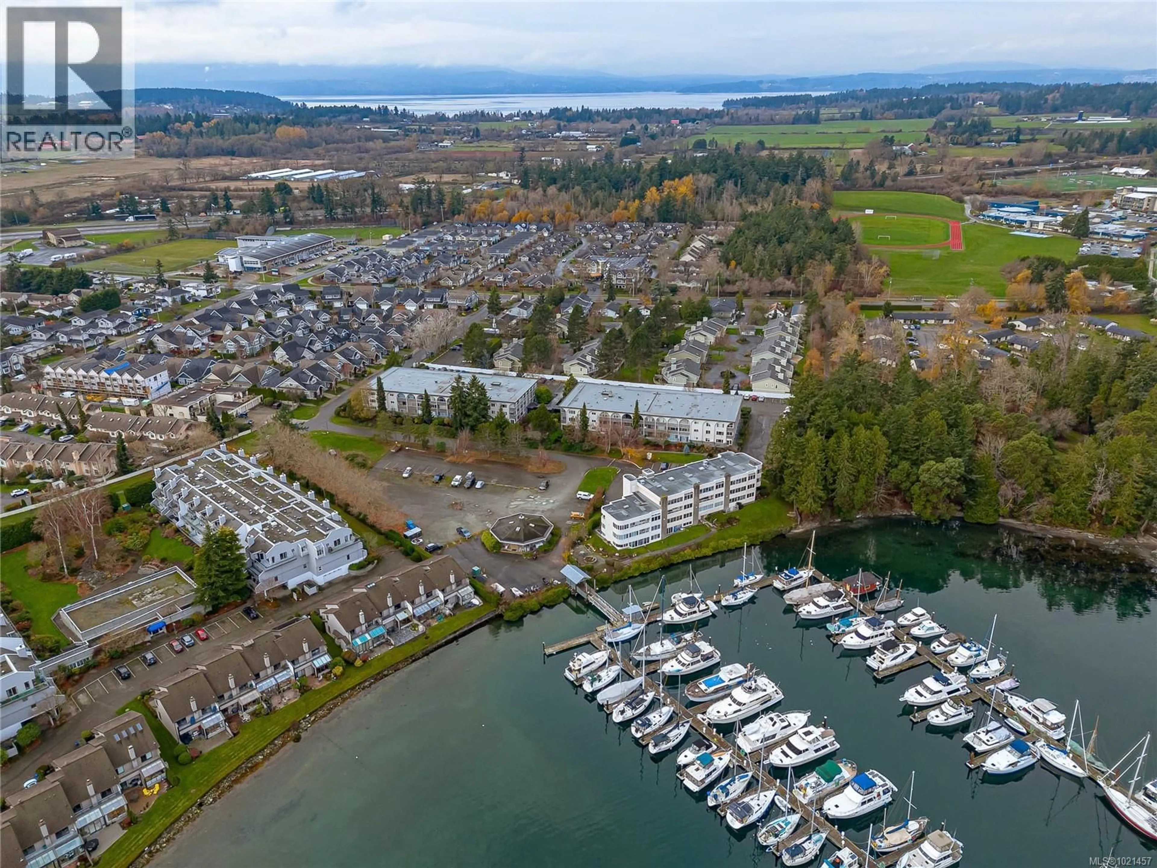 A pic from outside/outdoor area/front of a property/back of a property/a pic from drone, water/lake/river/ocean view for 307 - 2050 WHITE BIRCH ROAD, Sidney British Columbia V8L2R1