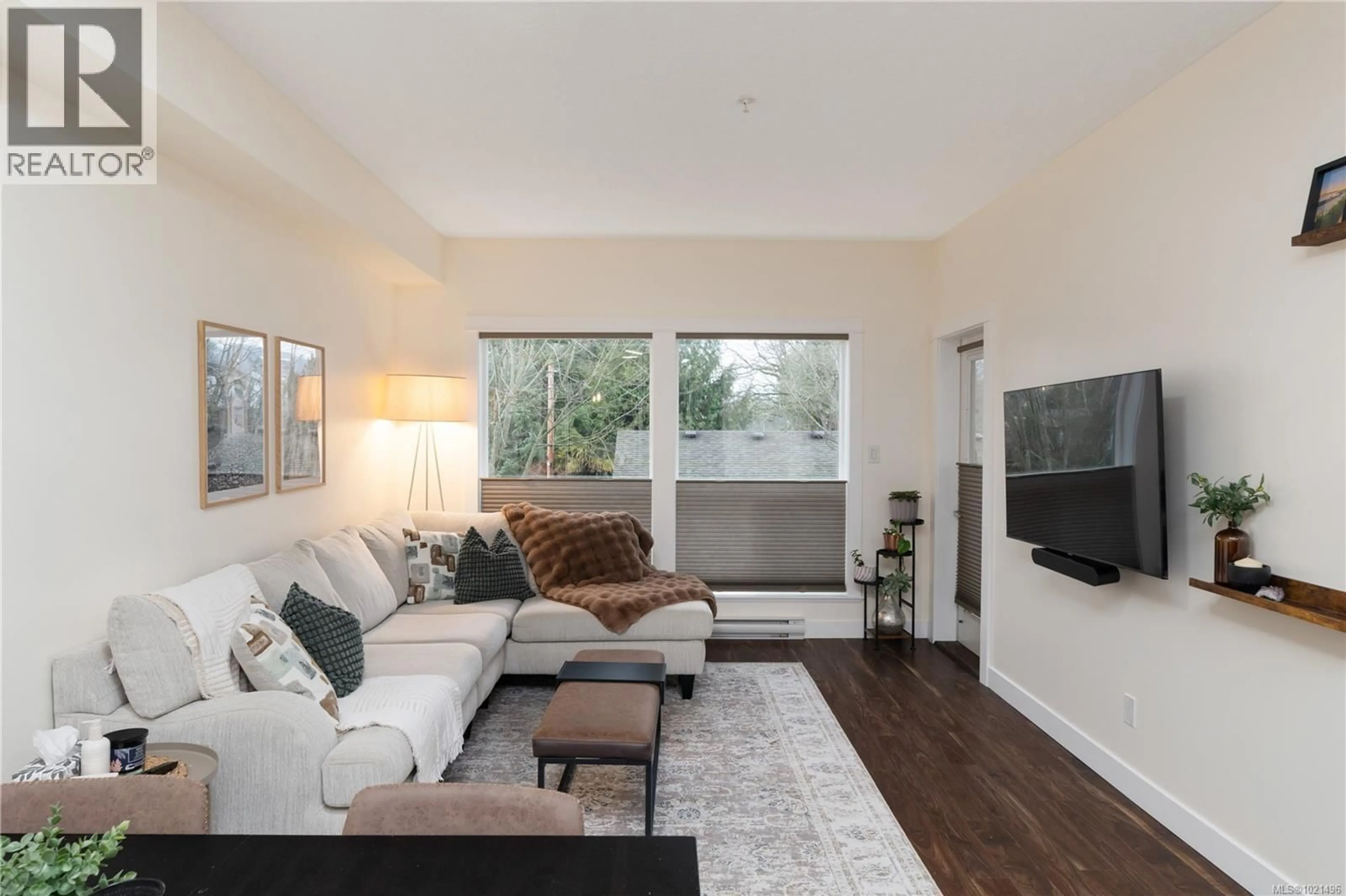 Living room with furniture, wood/laminate floor for 213 - 938 DUNFORD AVENUE, Langford British Columbia V9B2S3