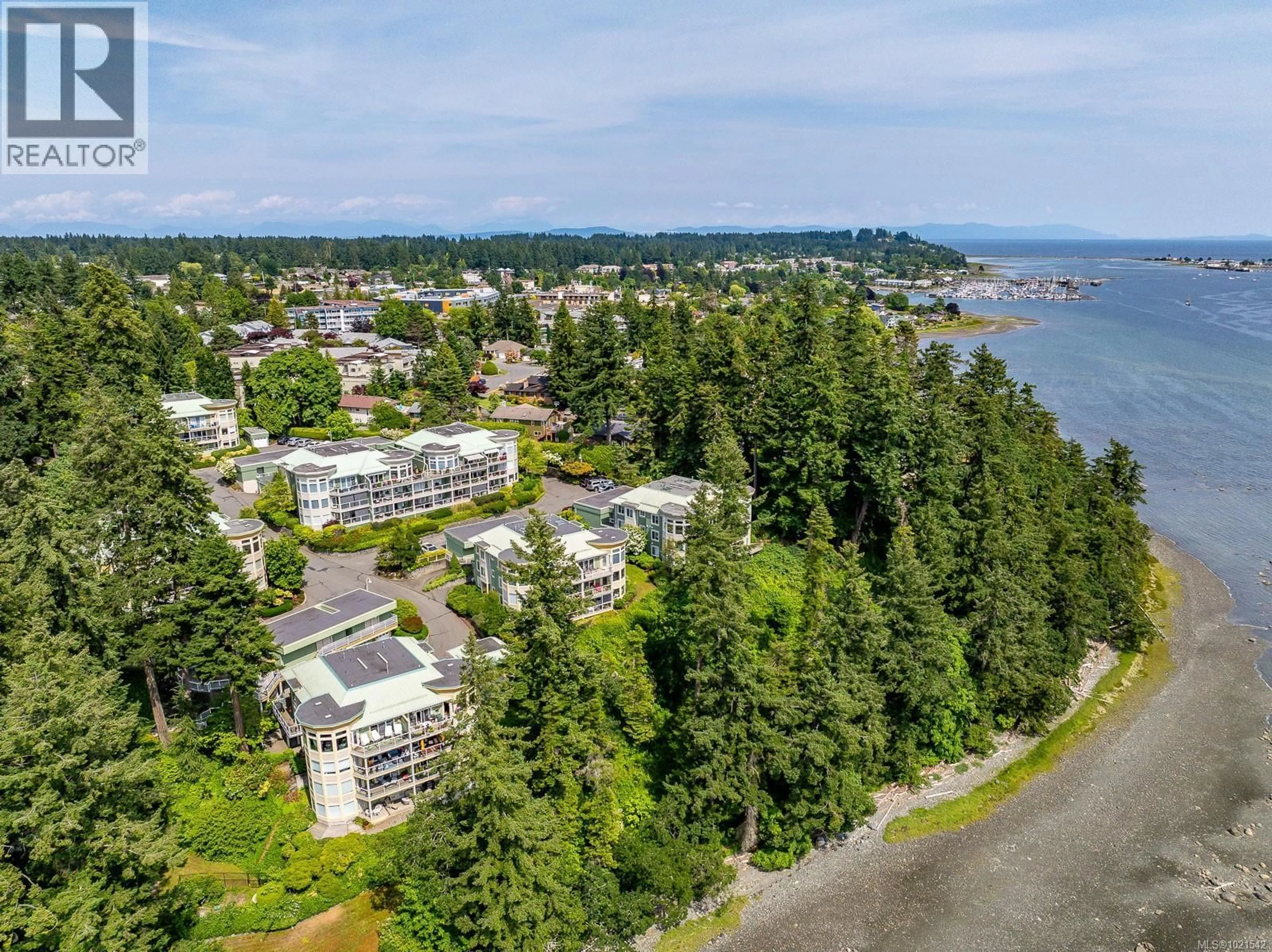 A pic from outside/outdoor area/front of a property/back of a property/a pic from drone, water/lake/river/ocean view for 412 - 2275 COMOX AVENUE, Comox British Columbia V9M1X6