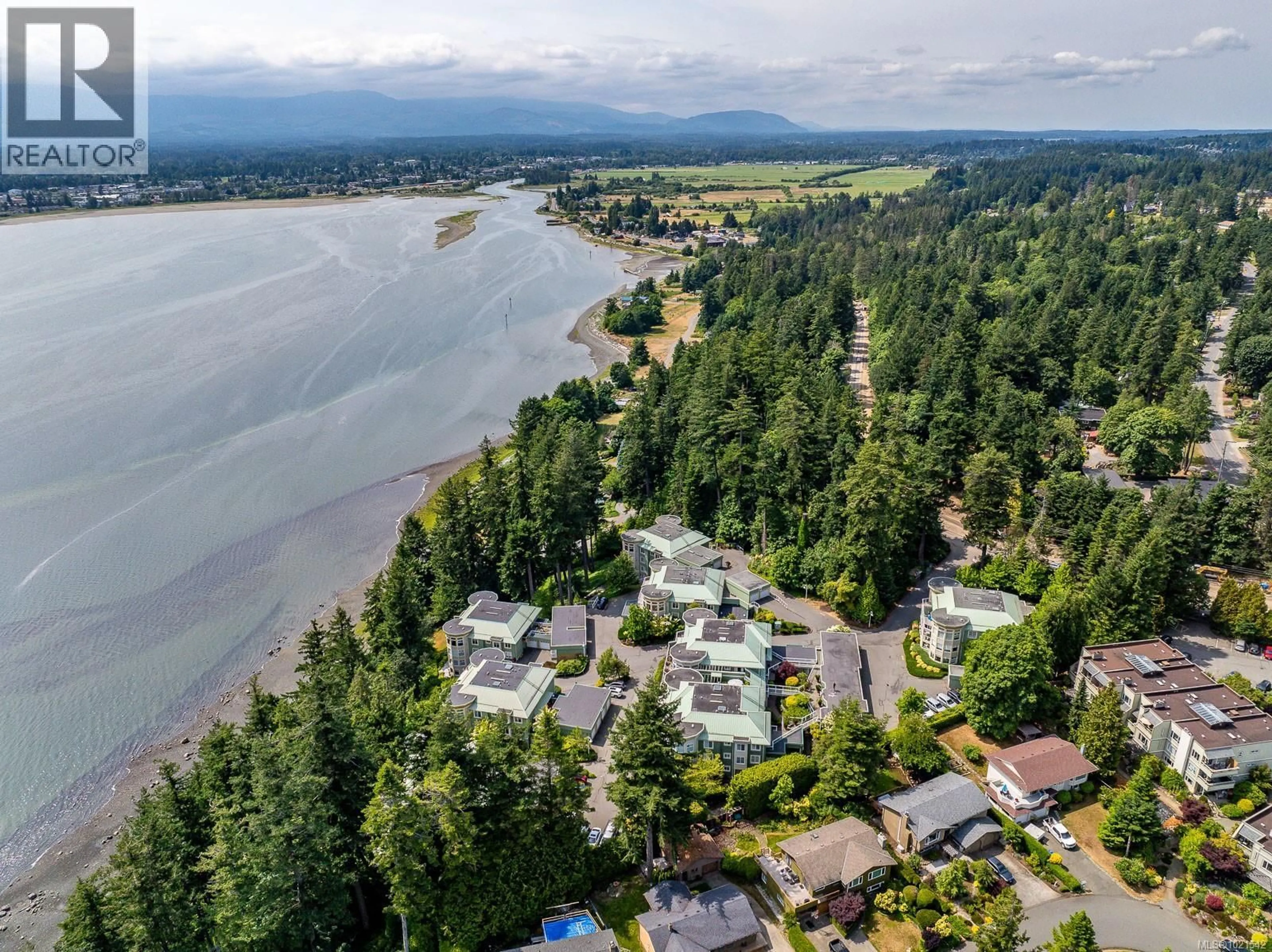 A pic from outside/outdoor area/front of a property/back of a property/a pic from drone, water/lake/river/ocean view for 412 - 2275 COMOX AVENUE, Comox British Columbia V9M1X6
