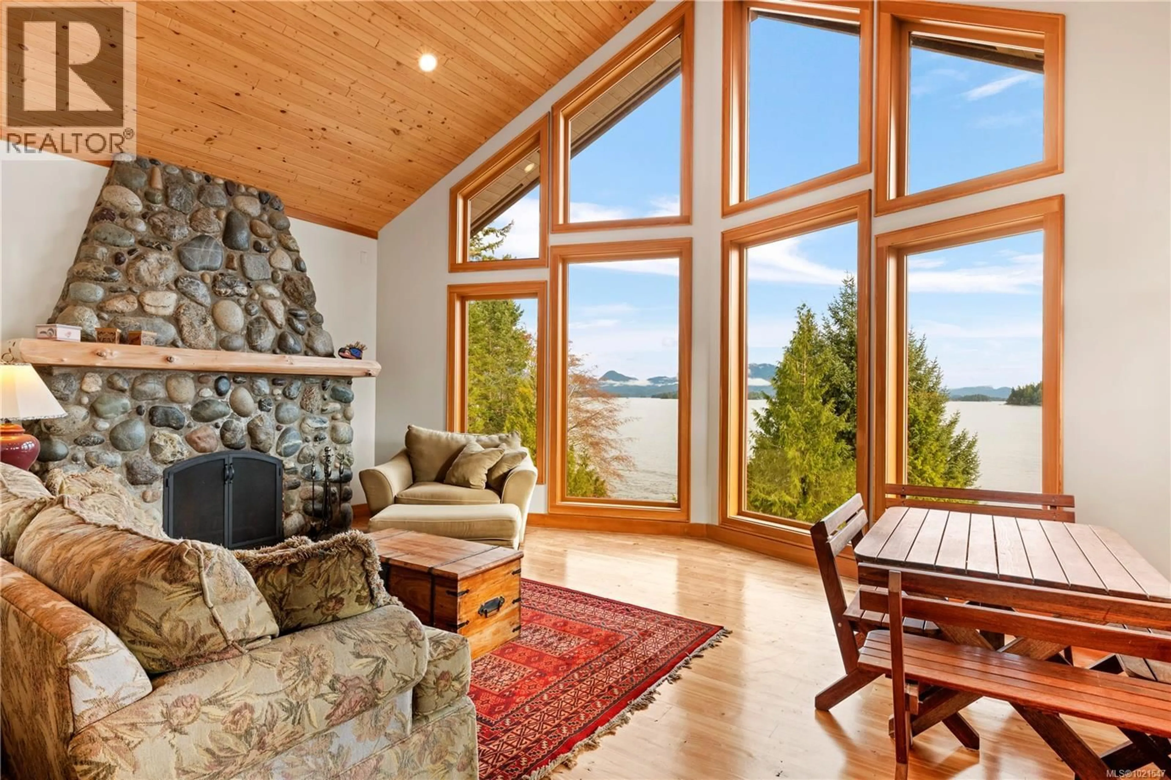 Living room with furniture, wood/laminate floor for 1062 5TH AVENUE, Ucluelet British Columbia V0R3A0