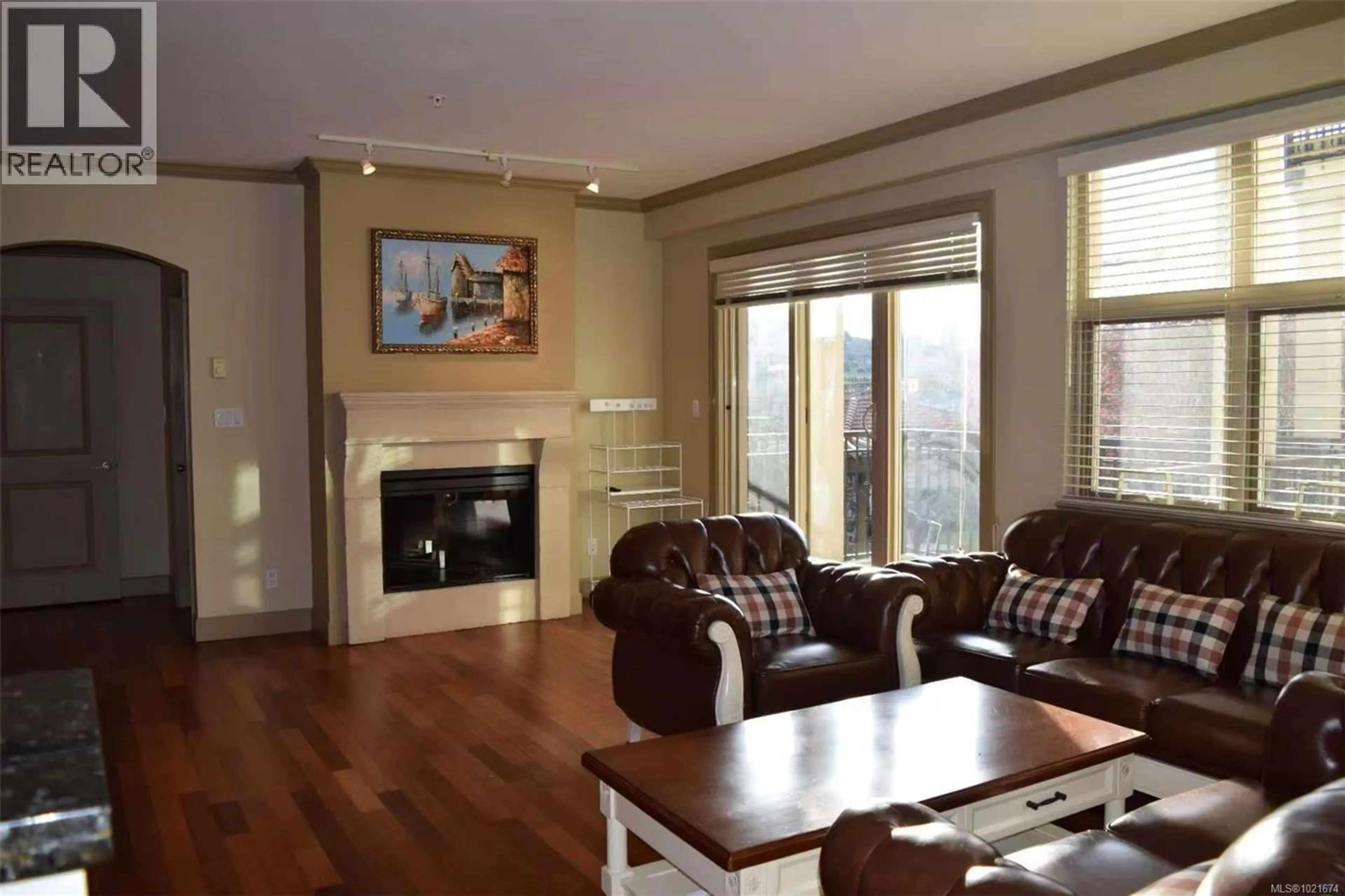 Living room with furniture, wood/laminate floor for 309 - 1620 MCKENZIE AVENUE, Saanich British Columbia V8N0A1