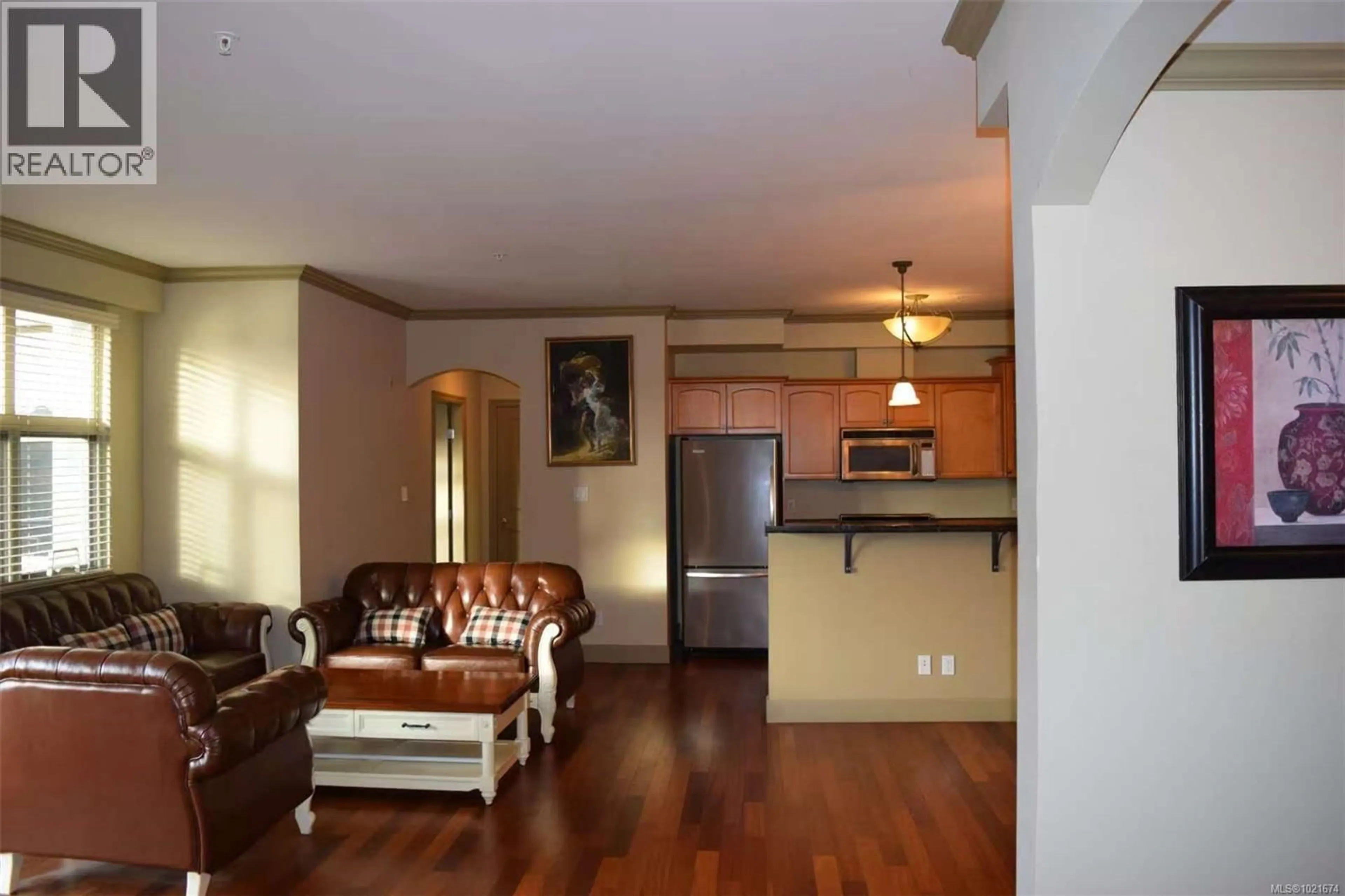 Living room with furniture, wood/laminate floor for 309 - 1620 MCKENZIE AVENUE, Saanich British Columbia V8N0A1