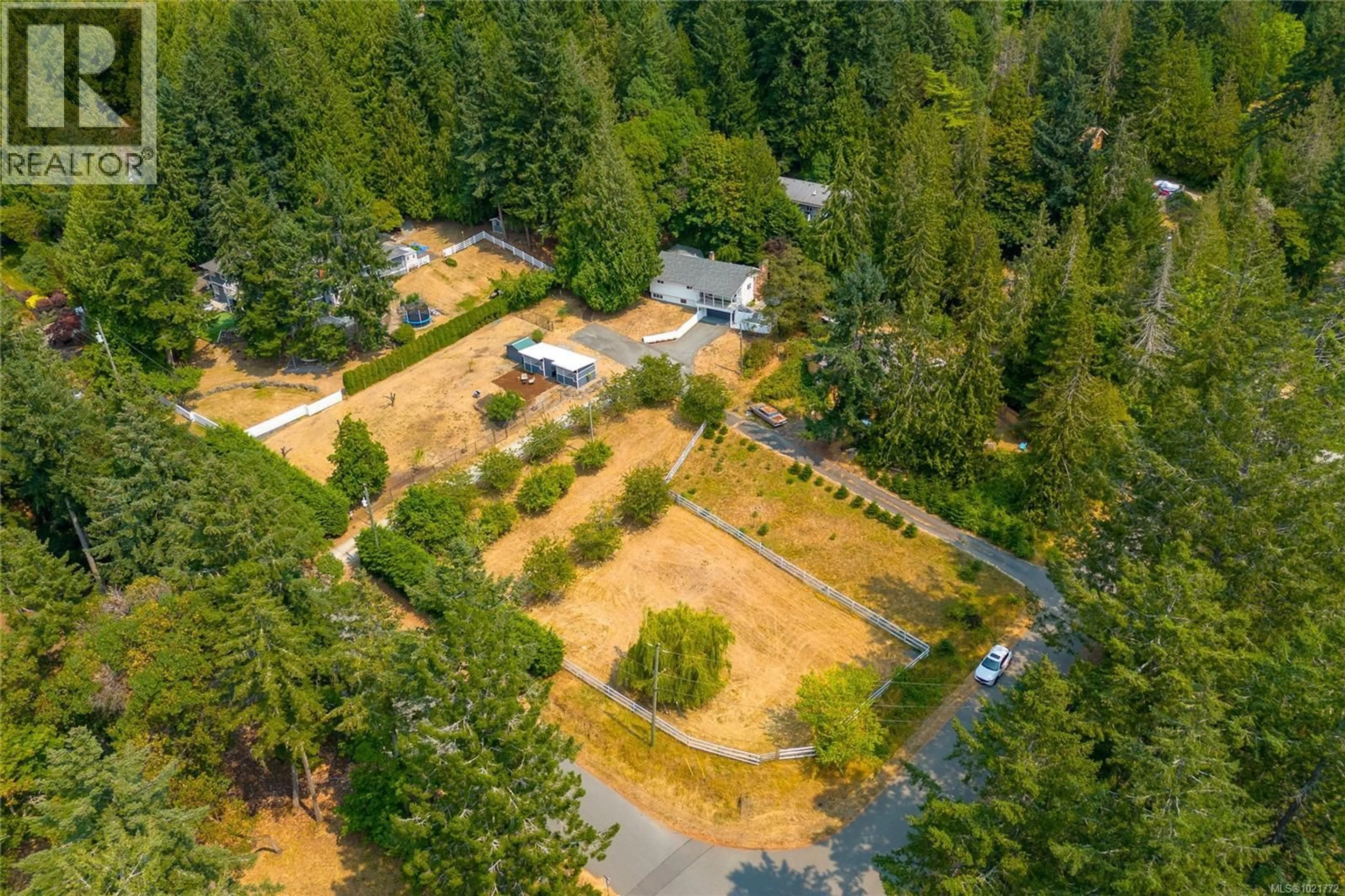 A pic from outside/outdoor area/front of a property/back of a property/a pic from drone, forest/trees view for 11255 NITINAT ROAD, North Saanich British Columbia V8L5R8
