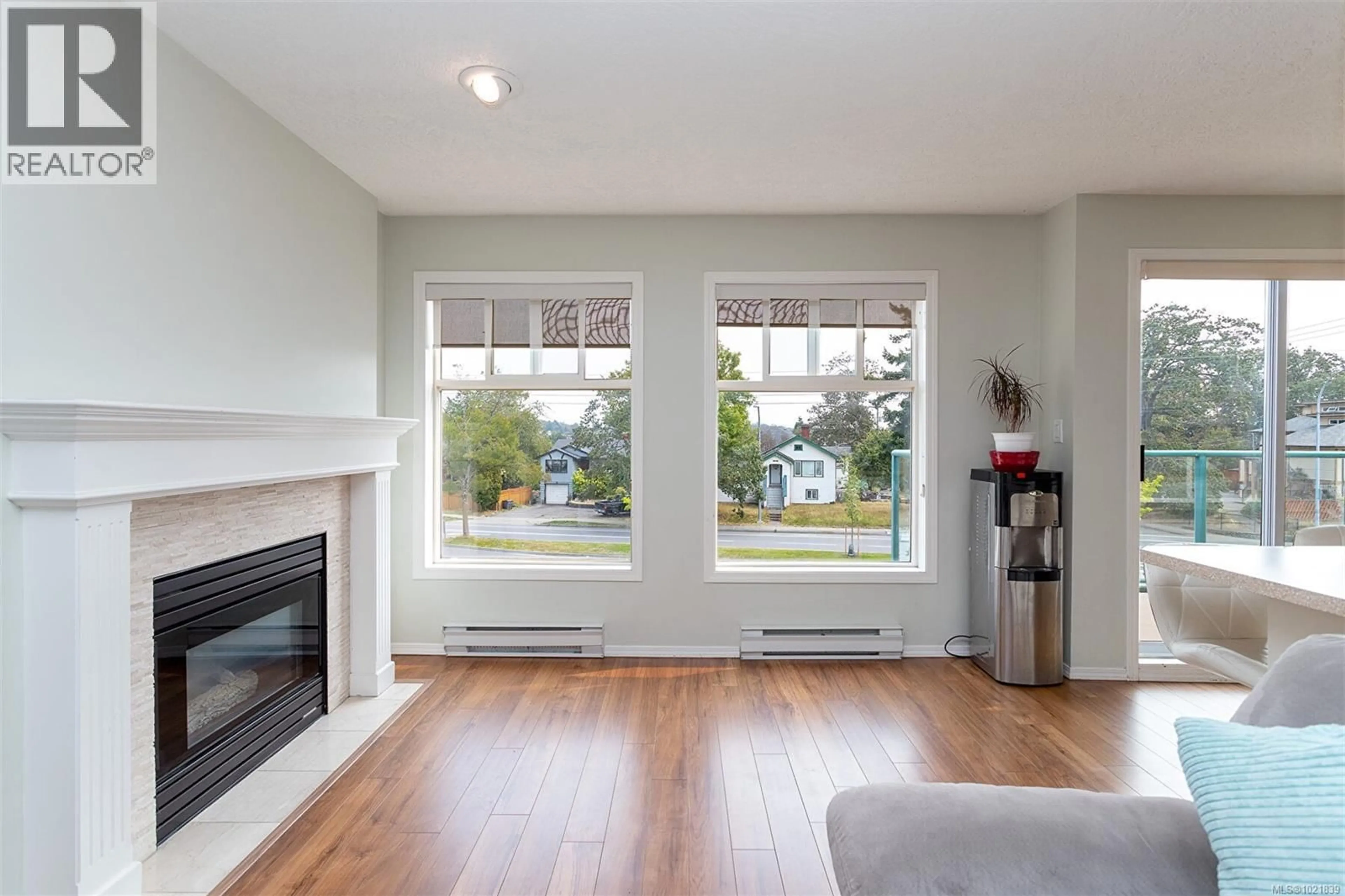 Living room with furniture, wood/laminate floor for 405 - 898 VERNON AVENUE, Saanich British Columbia V8X2W6