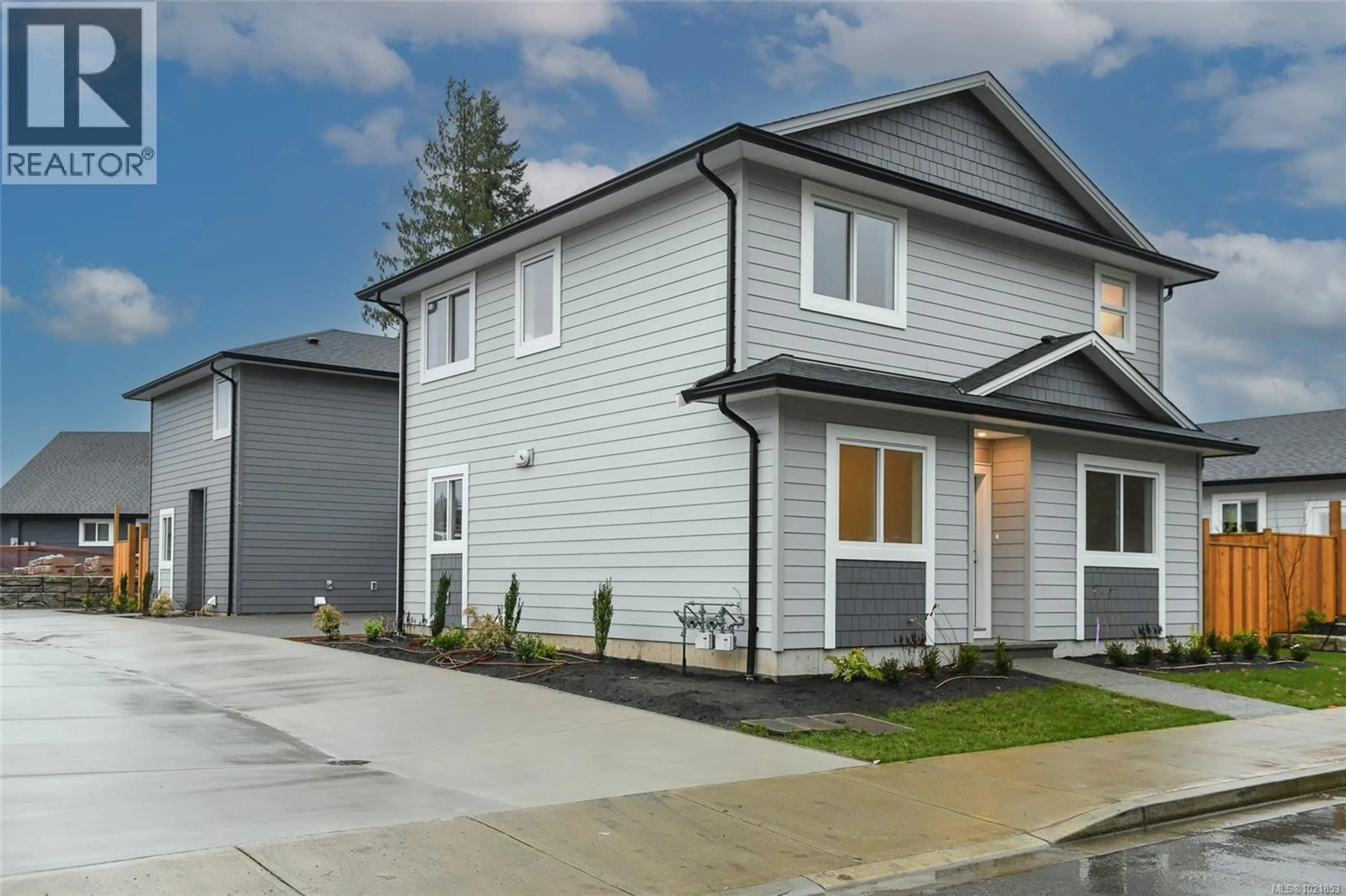 Home with vinyl exterior material, street for A - 2317 MCDONALD ROAD, Comox British Columbia V9M0C8