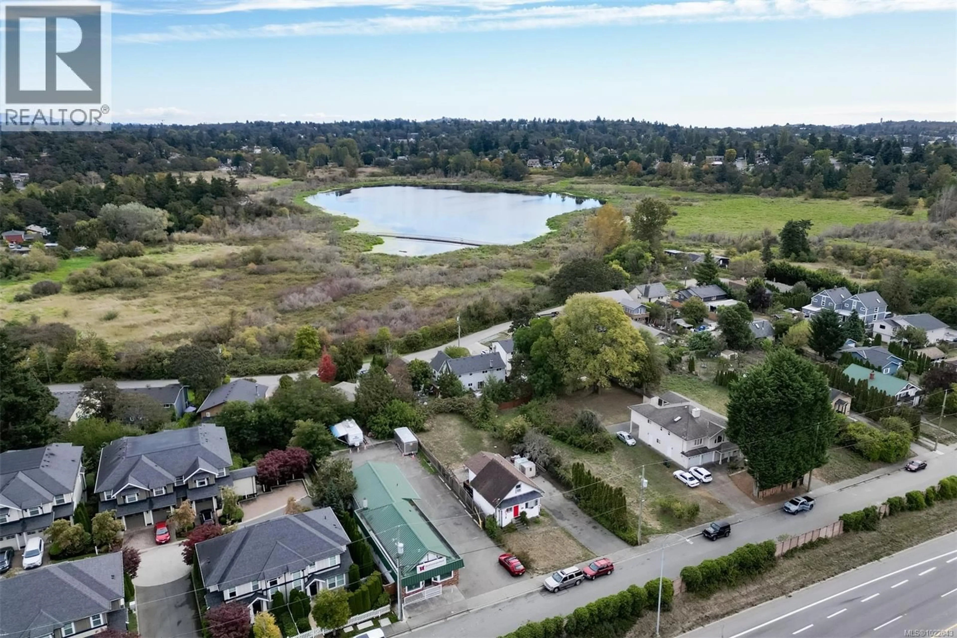 A pic from outside/outdoor area/front of a property/back of a property/a pic from drone, water/lake/river/ocean view for 3883 DOUGLAS STREET, Saanich British Columbia V8Z3M1