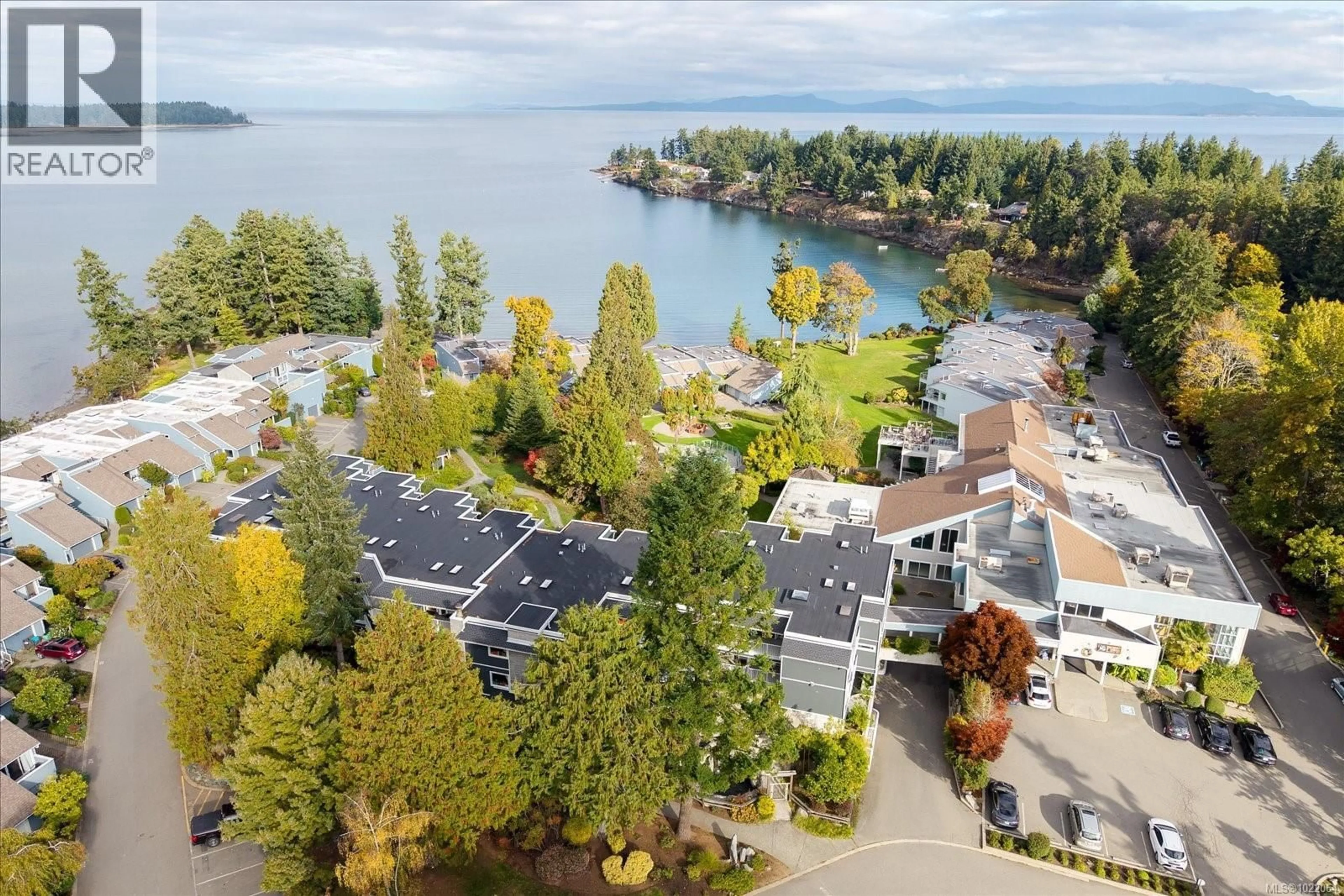 A pic from outside/outdoor area/front of a property/back of a property/a pic from drone, water/lake/river/ocean view for 711 - 1600 STROULGER ROAD, Nanoose Bay British Columbia V9P9B7