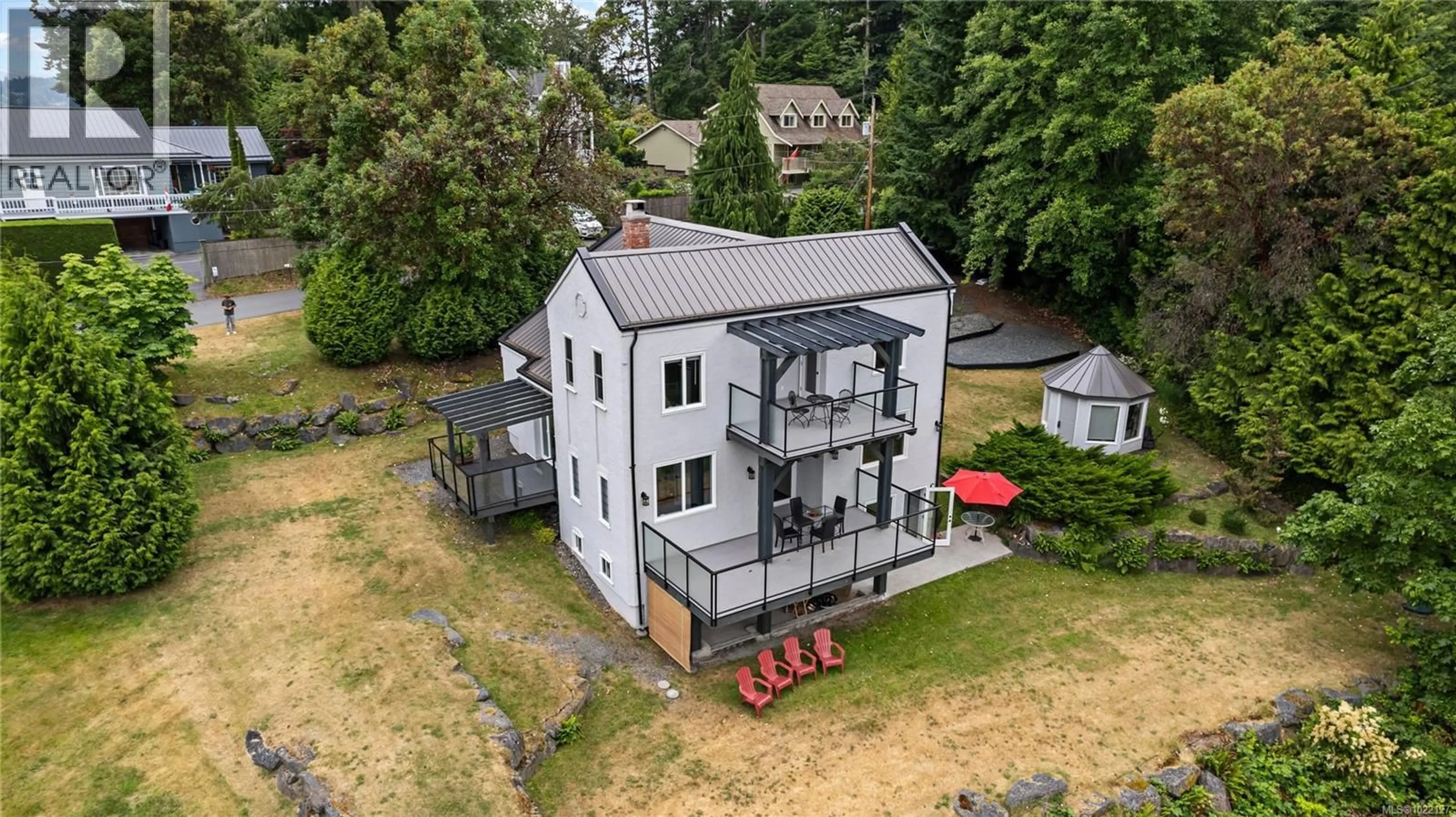 A pic from outside/outdoor area/front of a property/back of a property/a pic from drone, building for 5025 GENOA BAY ROAD, Duncan British Columbia V9L5Y6