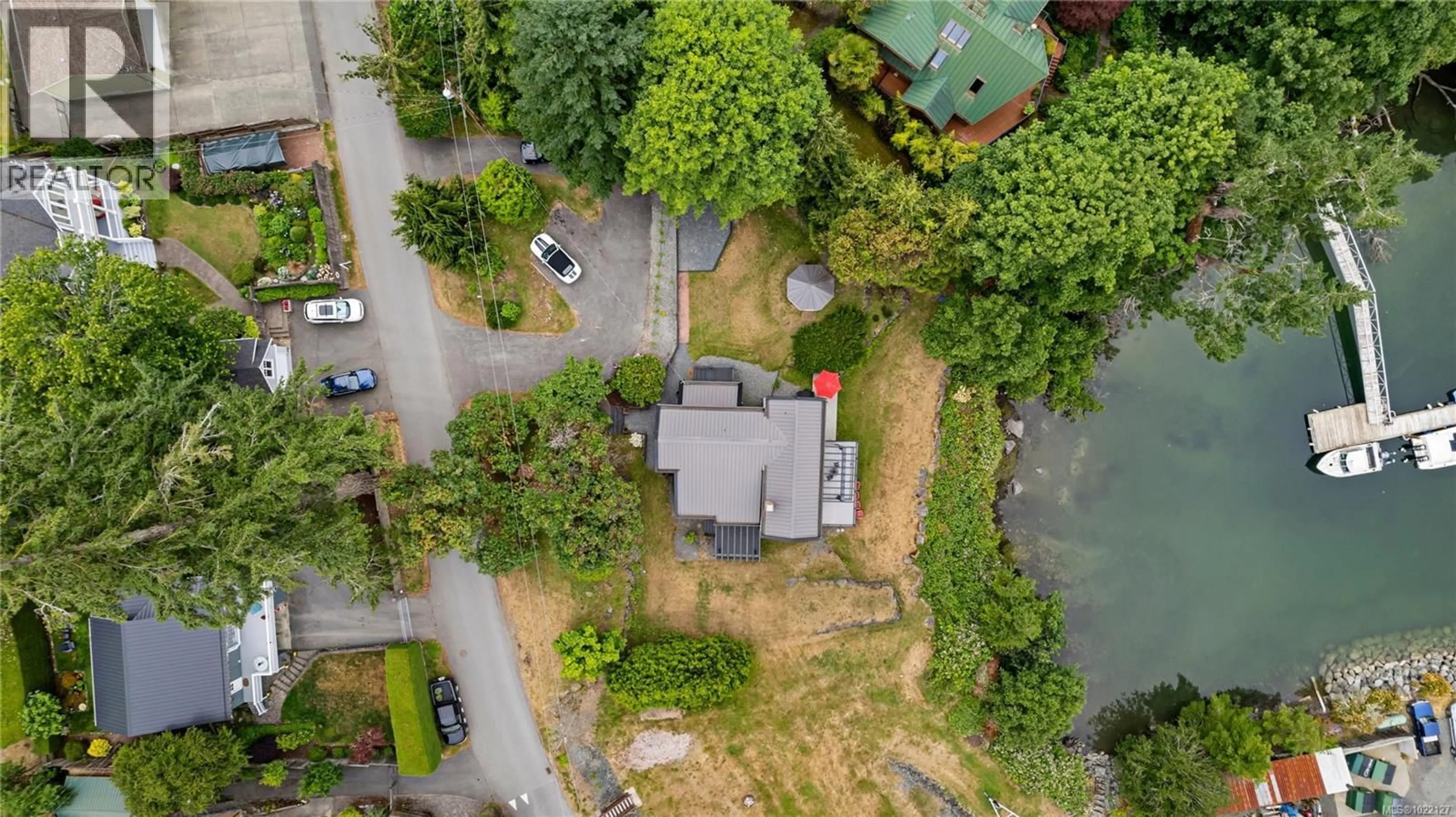 A pic from outside/outdoor area/front of a property/back of a property/a pic from drone, street for 5025 GENOA BAY ROAD, Duncan British Columbia V9L5Y6