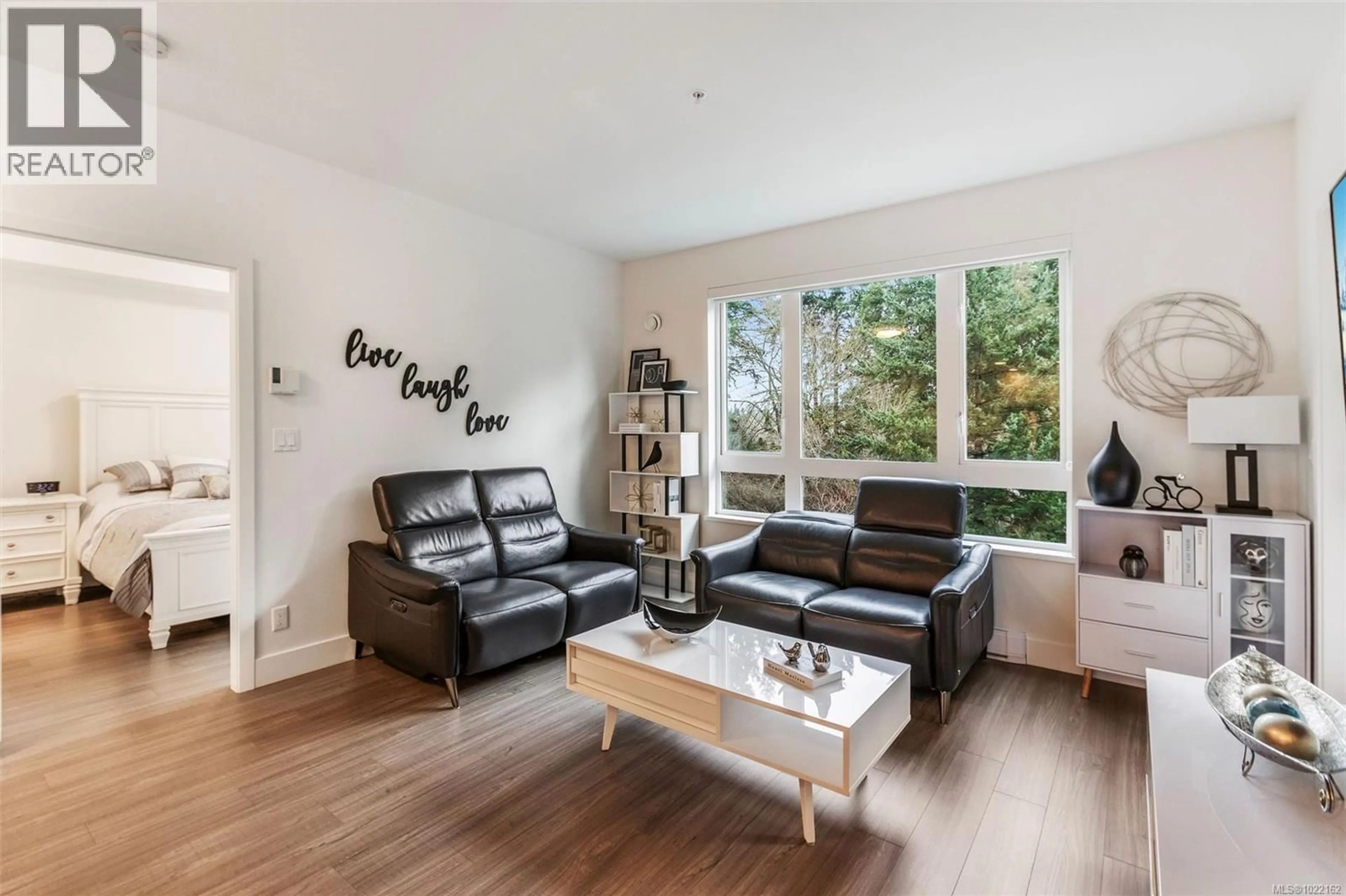 Living room with furniture, wood/laminate floor for 211 - 960 REUNION AVENUE, Langford British Columbia V9B0W5