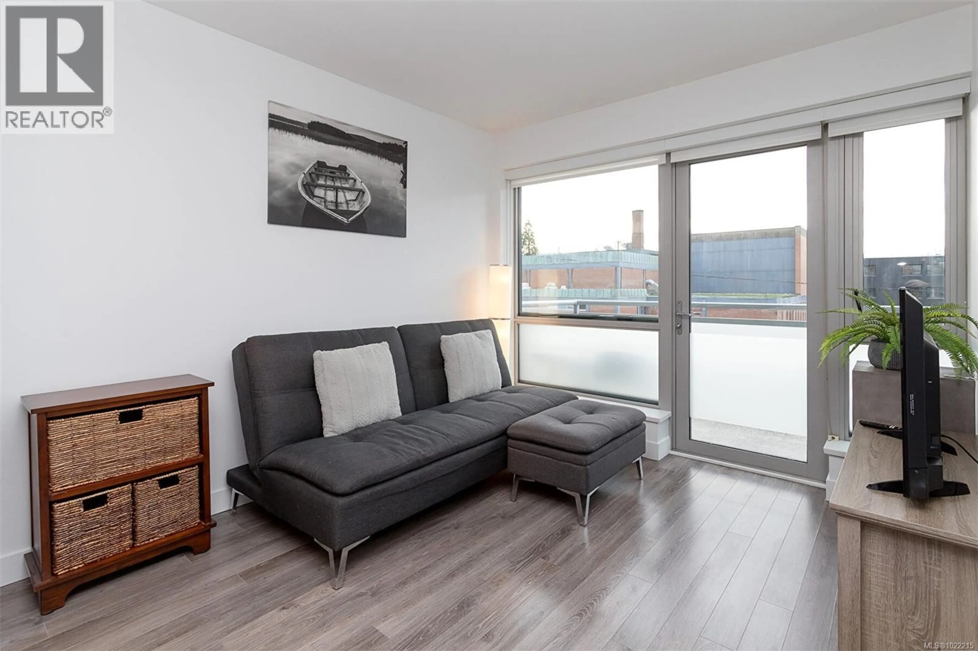 Living room with furniture, wood/laminate floor for 309 - 838 BROUGHTON STREET, Victoria British Columbia V8W1E4