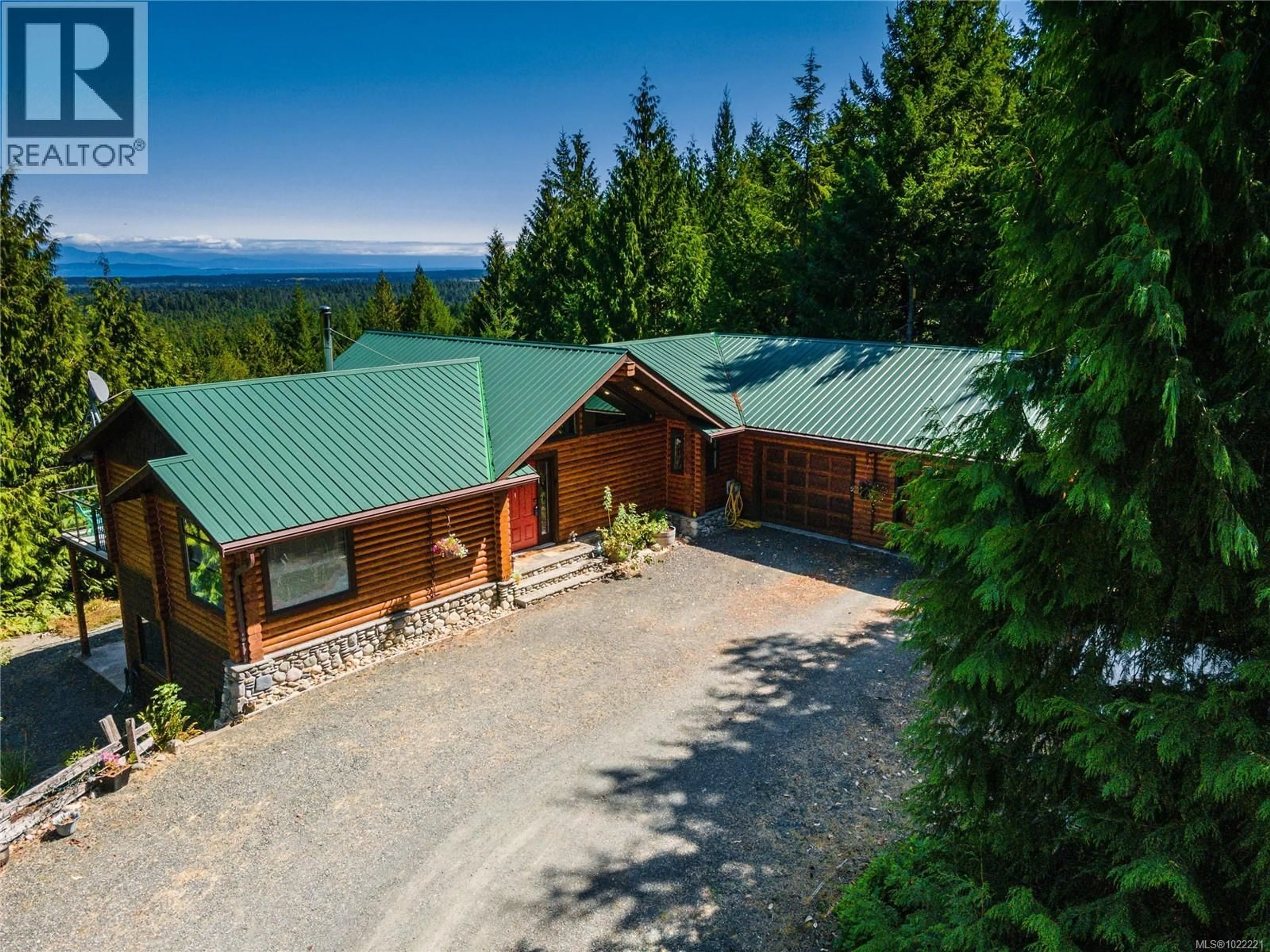 A pic from outside/outdoor area/front of a property/back of a property/a pic from drone, mountain view for 1685 PELIGREN PLACE, Qualicum Beach British Columbia V9K2S3