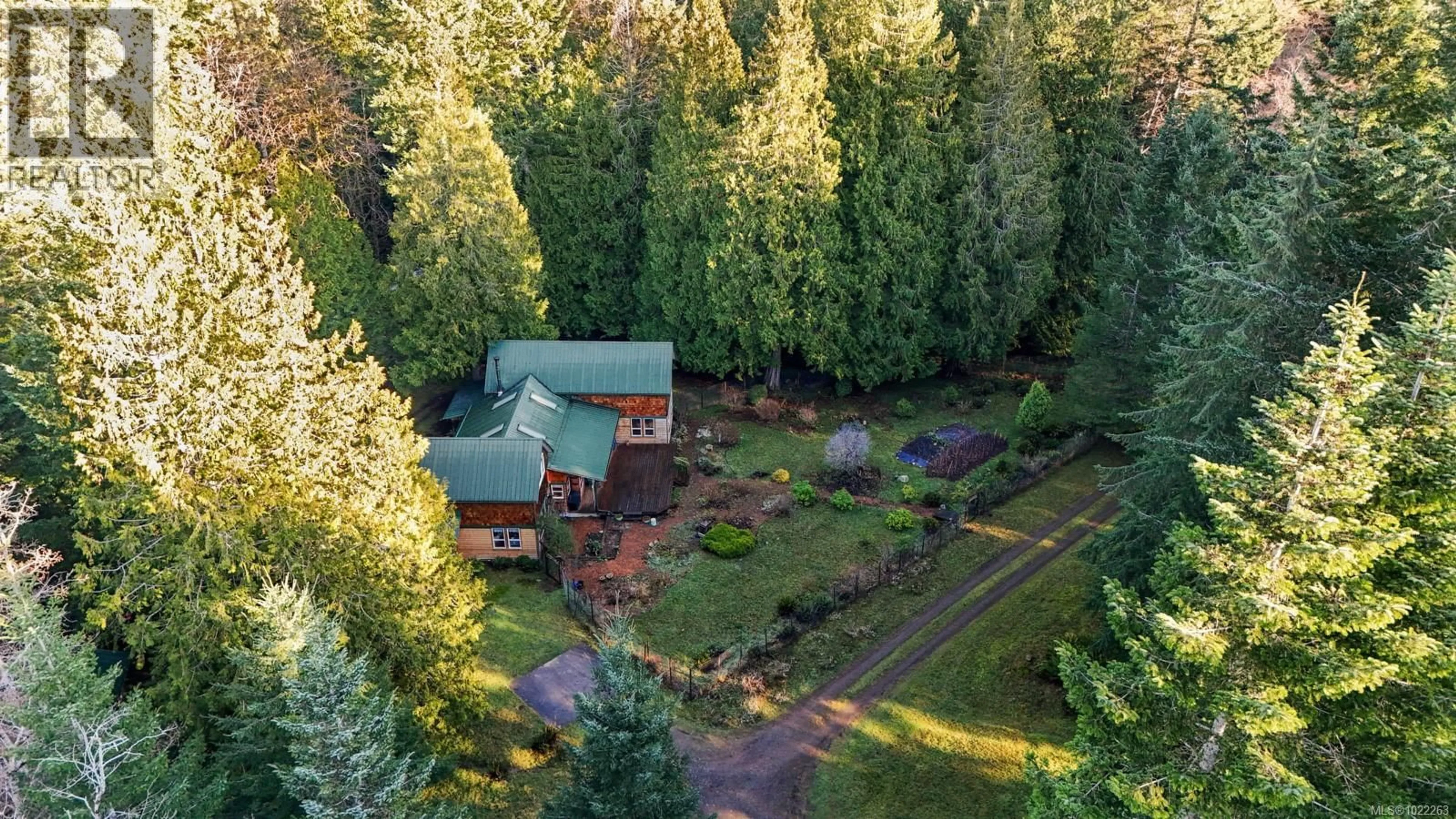 A pic from outside/outdoor area/front of a property/back of a property/a pic from drone, forest/trees view for 8875 OWL CRESCENT, Denman Island British Columbia V0R1T0