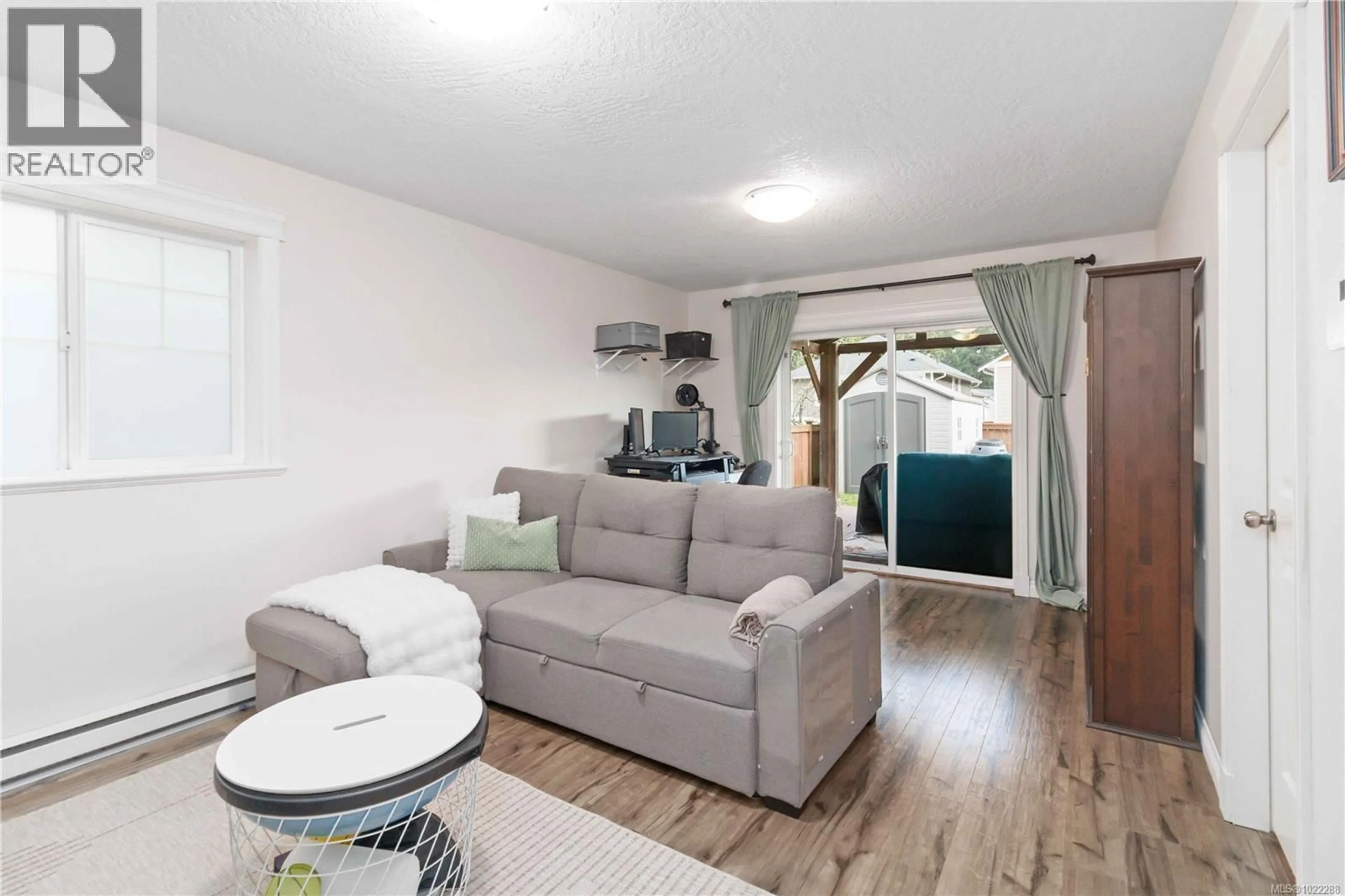 Living room with furniture, wood/laminate floor for 3587 VITALITY ROAD, Langford British Columbia V9C0E9