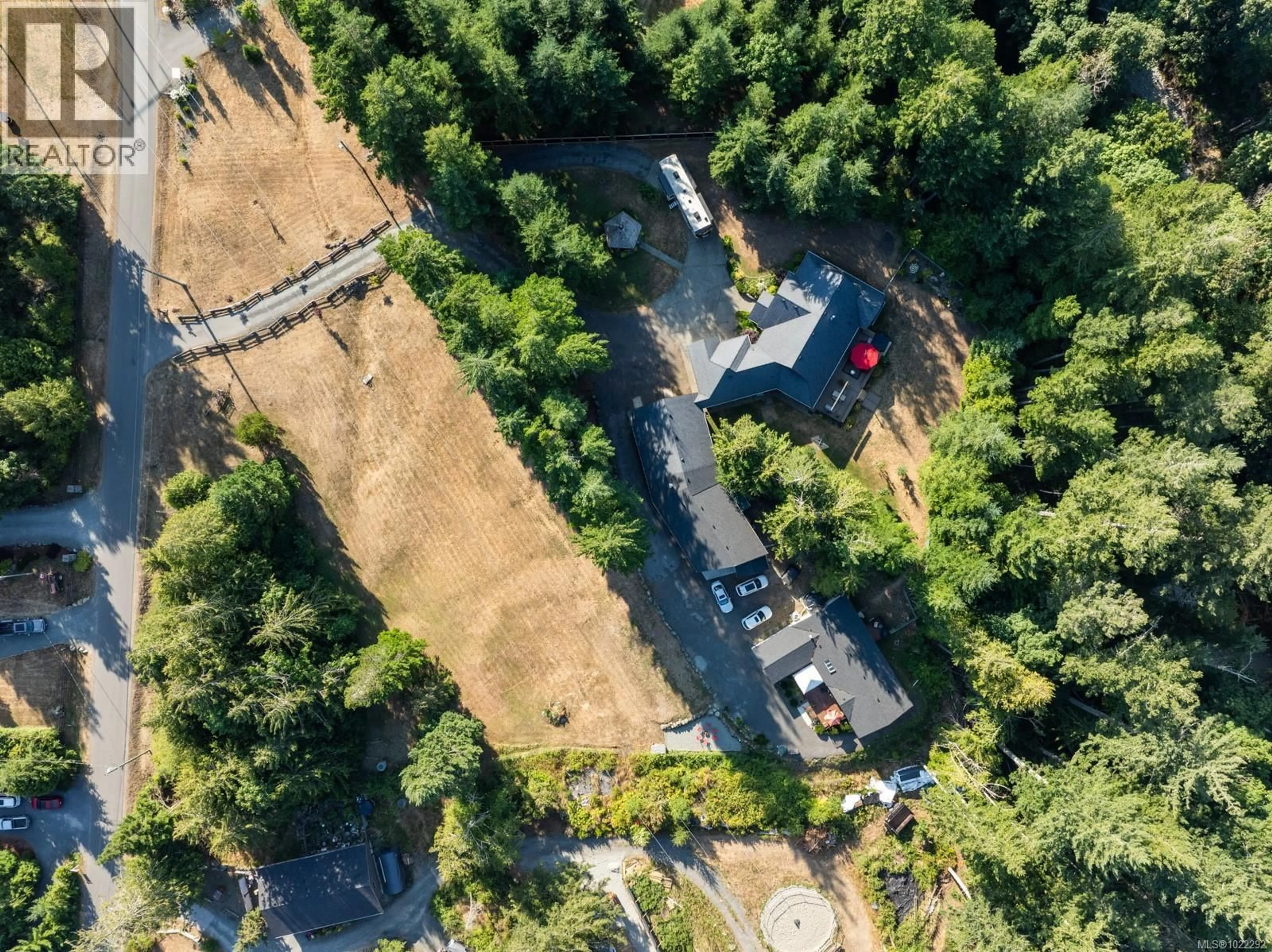 A pic from outside/outdoor area/front of a property/back of a property/a pic from drone, forest/trees view for 3035 SARAH DRIVE, Sooke British Columbia V9Z0J5