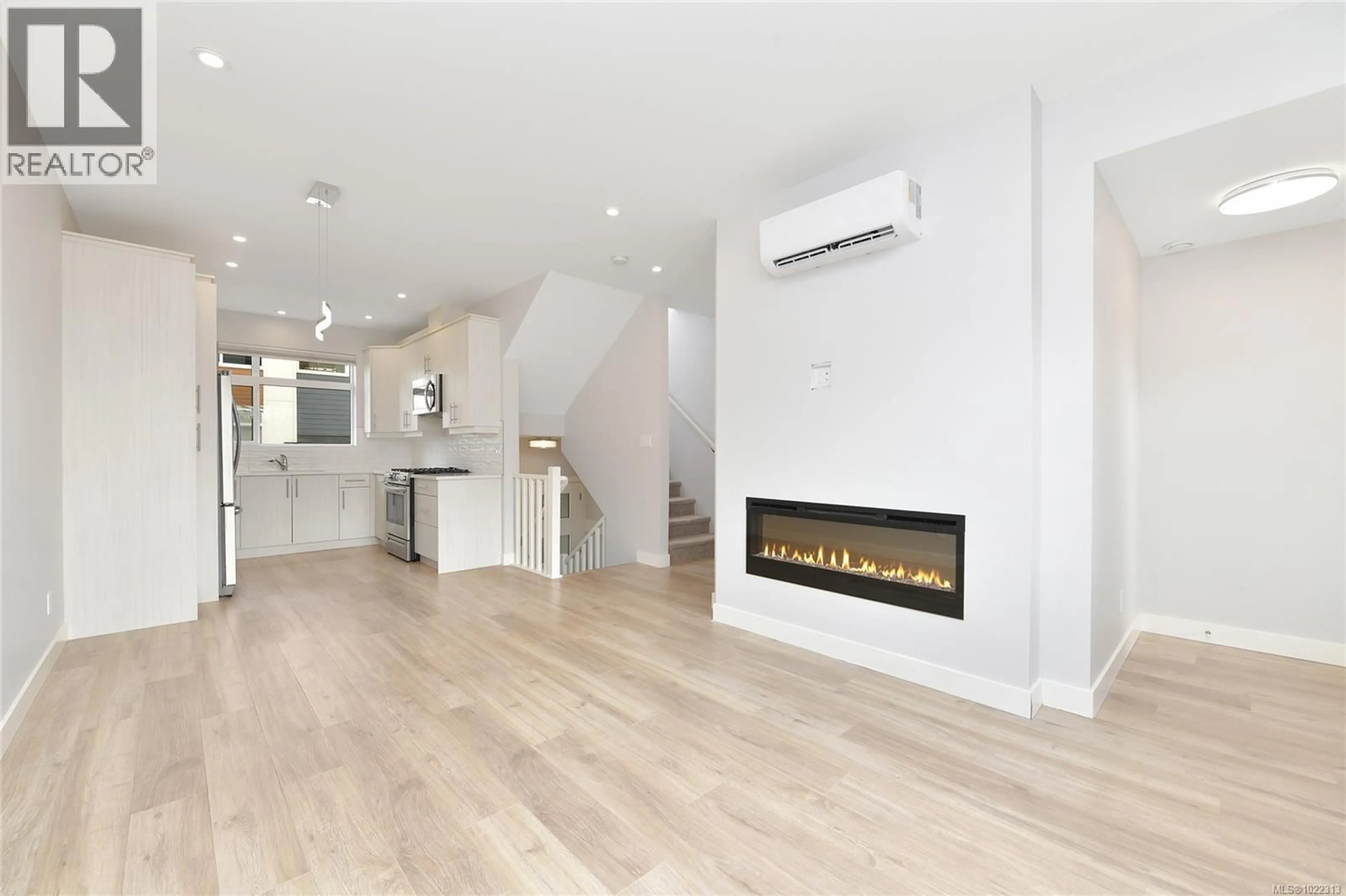 Open concept kitchen, wood/laminate floor for 104 - 3429 HAPPY VALLEY ROAD, Langford British Columbia V9C2X9