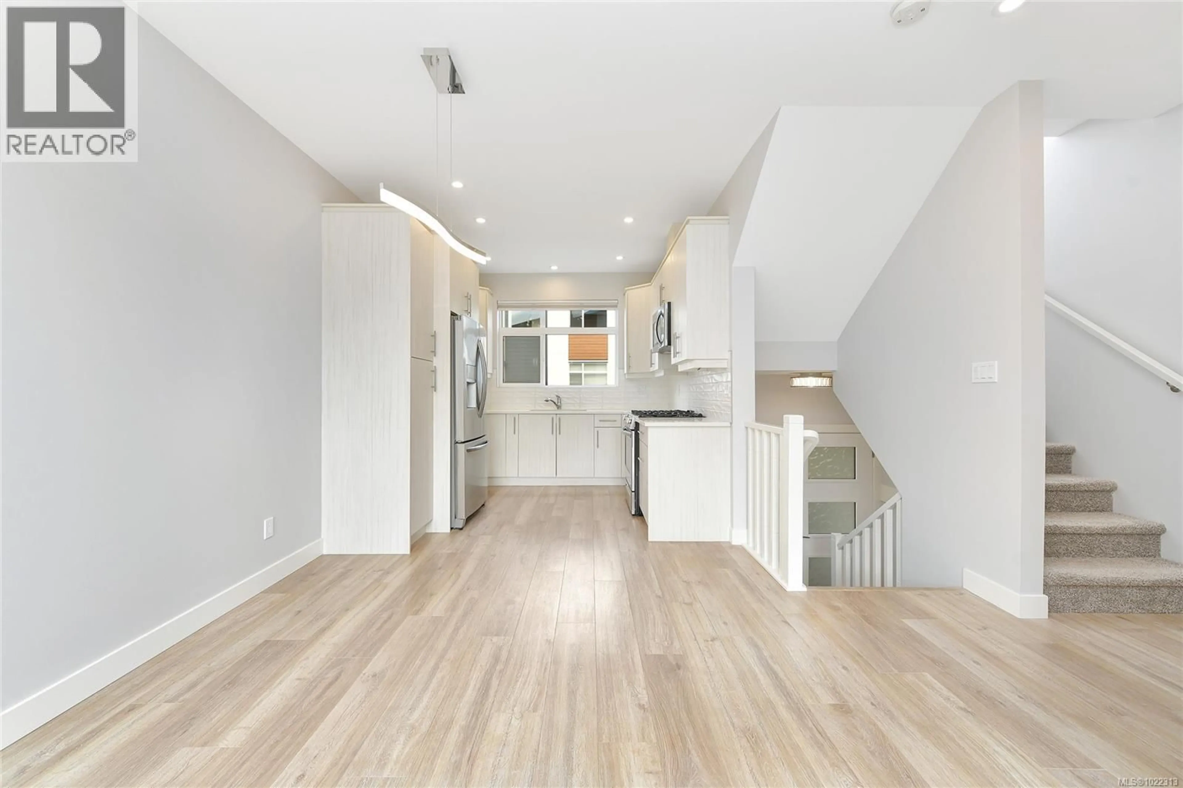 Open concept kitchen, wood/laminate floor for 104 - 3429 HAPPY VALLEY ROAD, Langford British Columbia V9C2X9