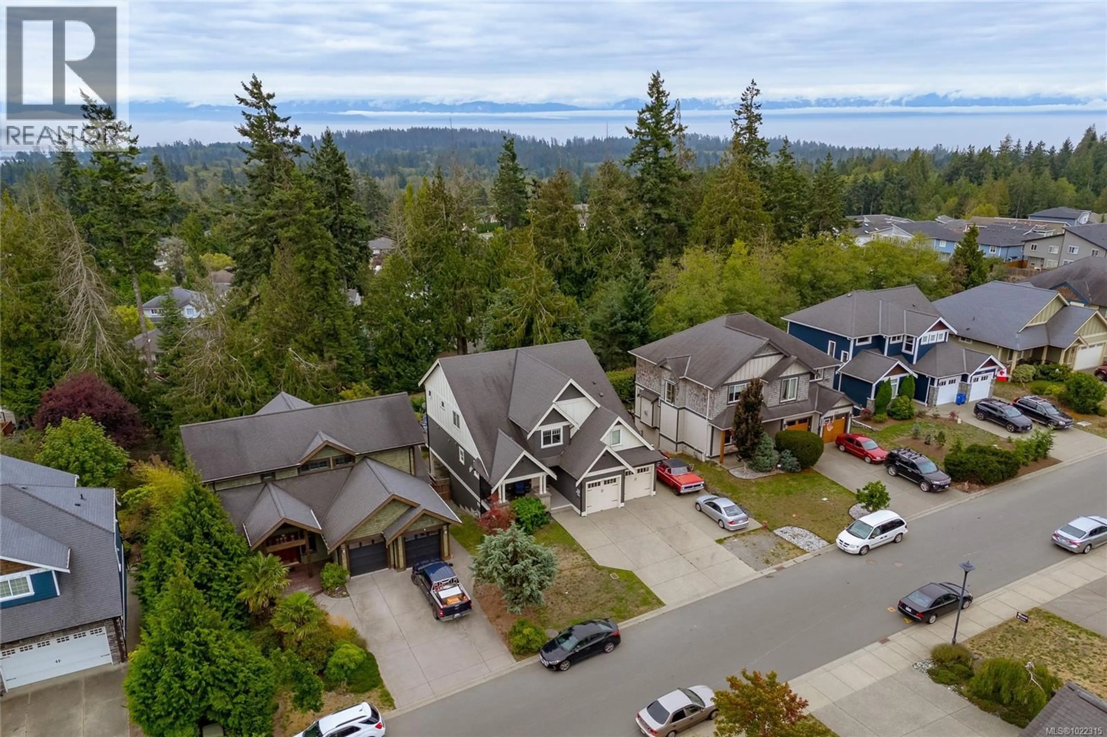 A pic from outside/outdoor area/front of a property/back of a property/a pic from drone, mountain view for 6983 BRAILSFORD PLACE, Sooke British Columbia V9Z1J7