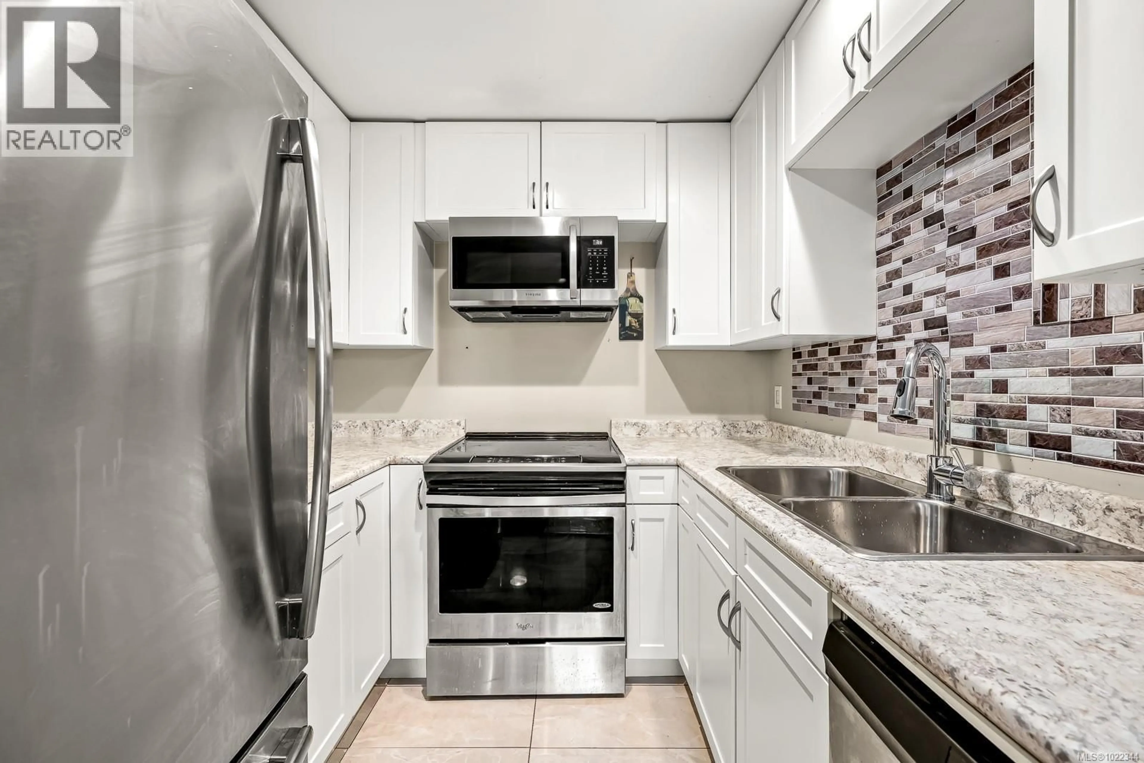 Standard kitchen, ceramic/tile floor for 409 - 282 BIRCH STREET, Campbell River British Columbia V9W2S3