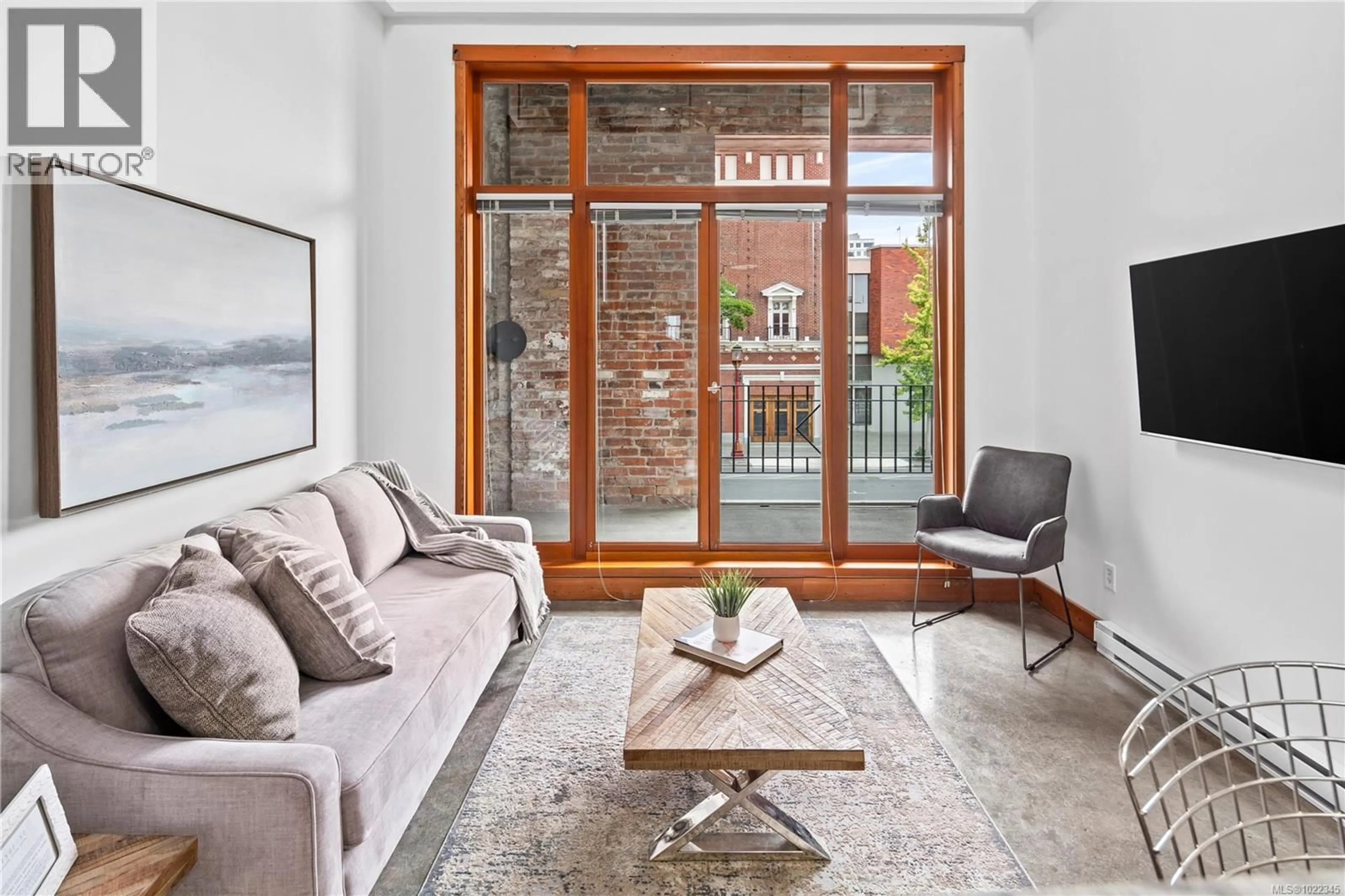 Living room with furniture, unknown for 204 - 588 PANDORA AVENUE, Victoria British Columbia V8W1N7