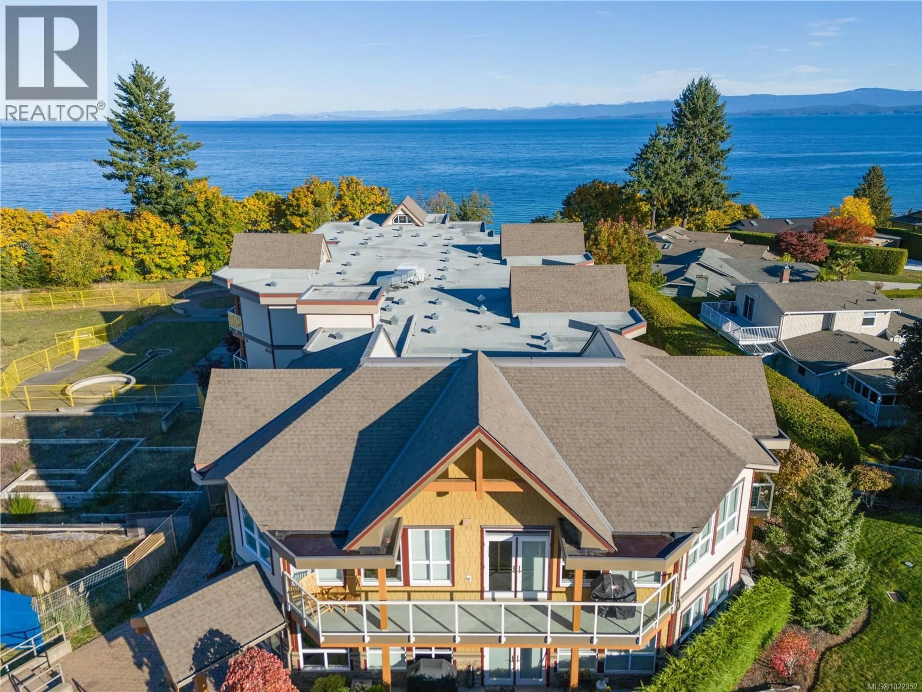 A pic from outside/outdoor area/front of a property/back of a property/a pic from drone, water/lake/river/ocean view for 203 - 439 COLLEGE ROAD, Qualicum Beach British Columbia V9K0B2