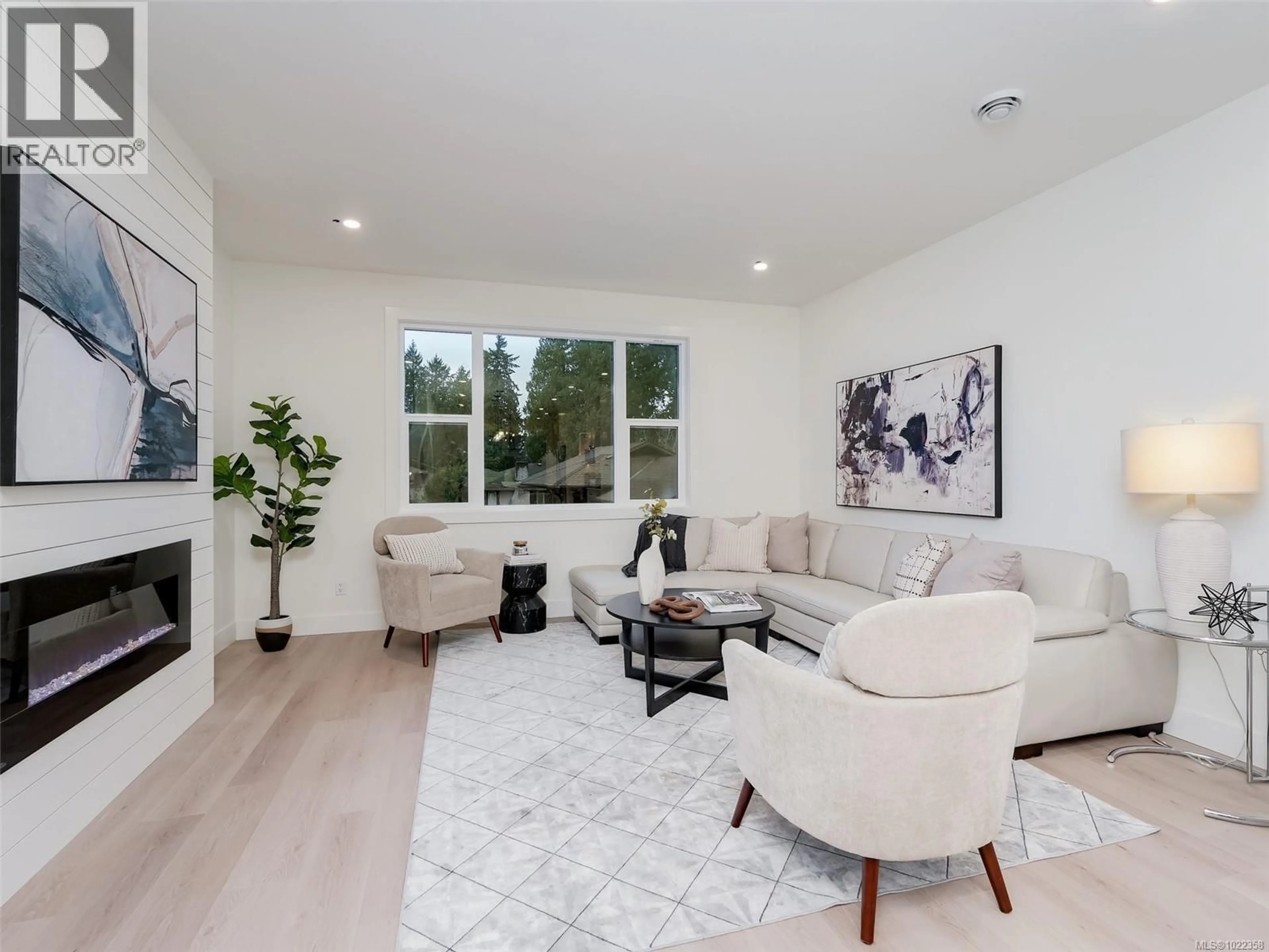 Living room with furniture, wood/laminate floor for 101 - 960 JENKINS AVENUE, Langford British Columbia V9B2N7