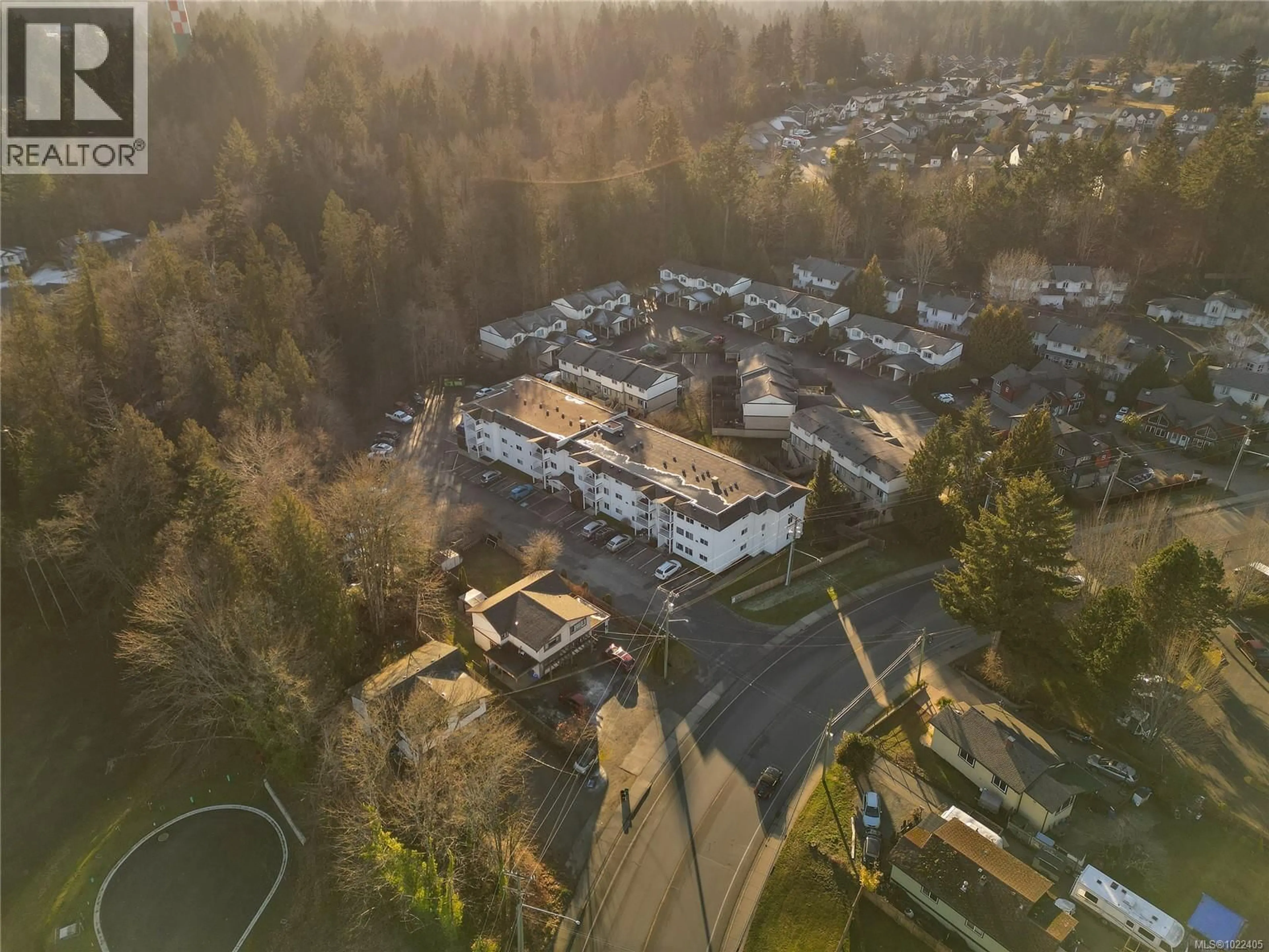 A pic from outside/outdoor area/front of a property/back of a property/a pic from drone, mountain view for 203 - 3226 COWICHAN LAKE ROAD, Duncan British Columbia V9L4B9