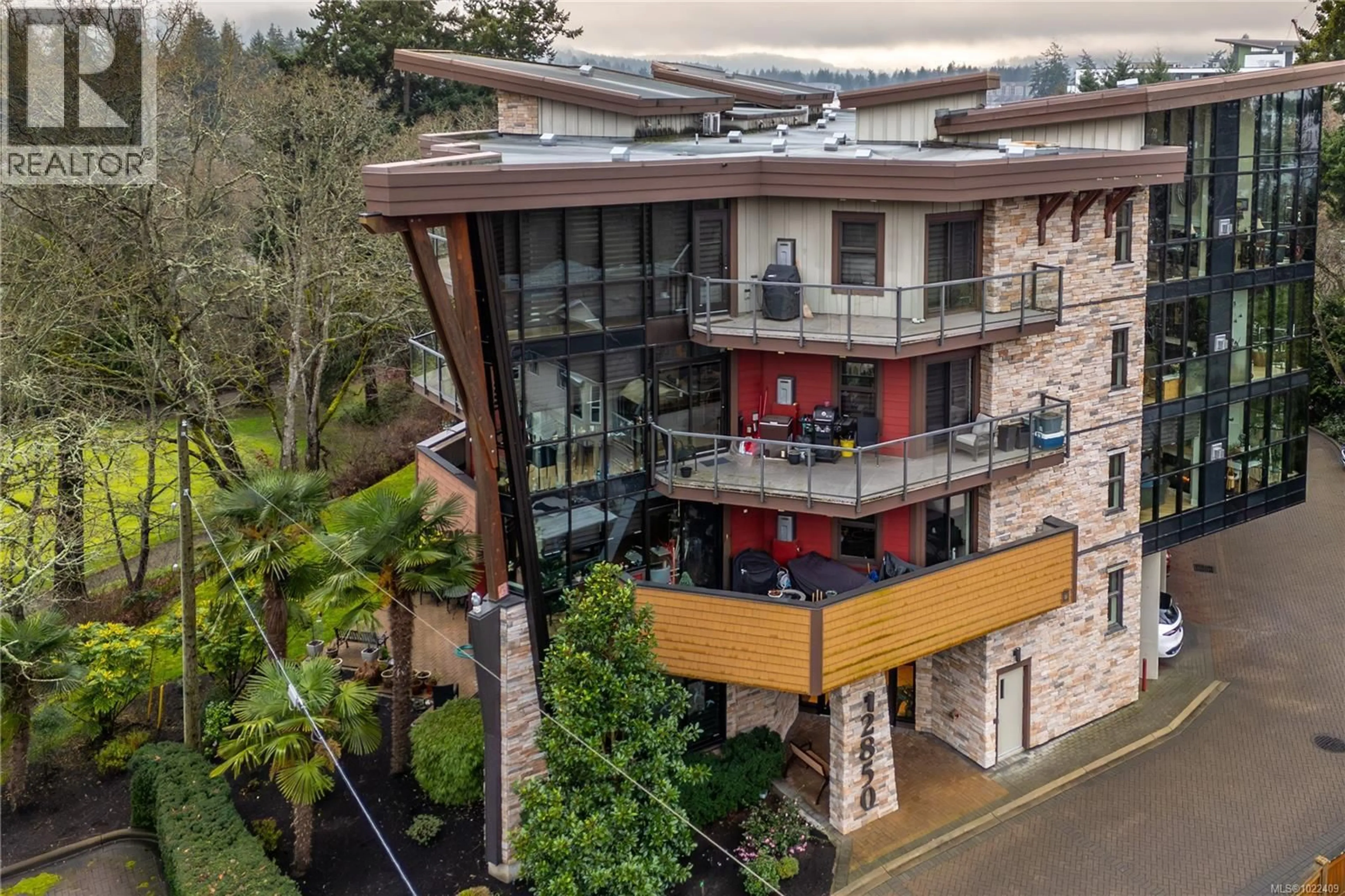 A pic from outside/outdoor area/front of a property/back of a property/a pic from drone, building for 203 - 2850 ALDWYND ROAD, Langford British Columbia V9B3S7
