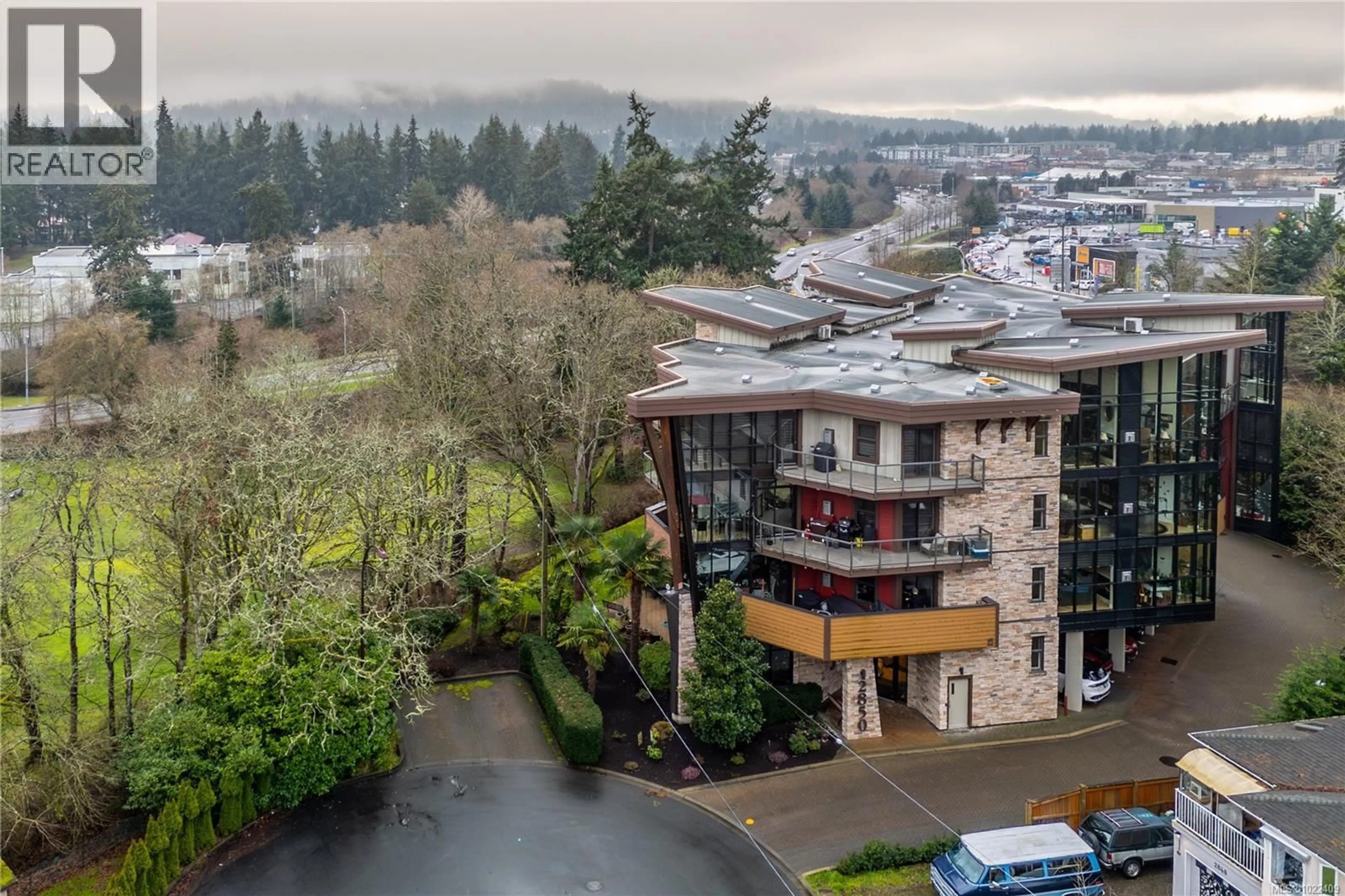 A pic from outside/outdoor area/front of a property/back of a property/a pic from drone, unknown for 203 - 2850 ALDWYND ROAD, Langford British Columbia V9B3S7