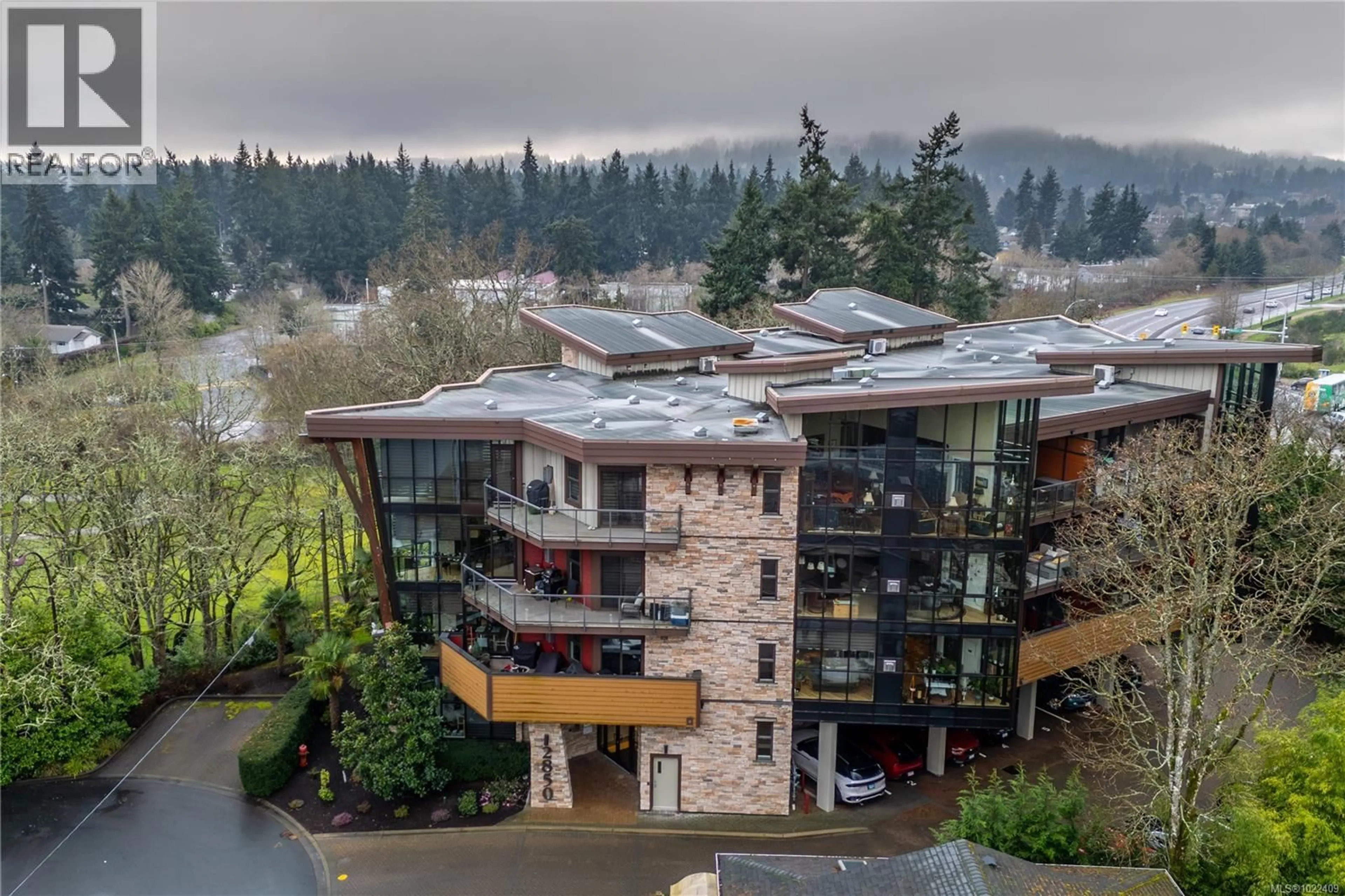 A pic from outside/outdoor area/front of a property/back of a property/a pic from drone, unknown for 203 - 2850 ALDWYND ROAD, Langford British Columbia V9B3S7