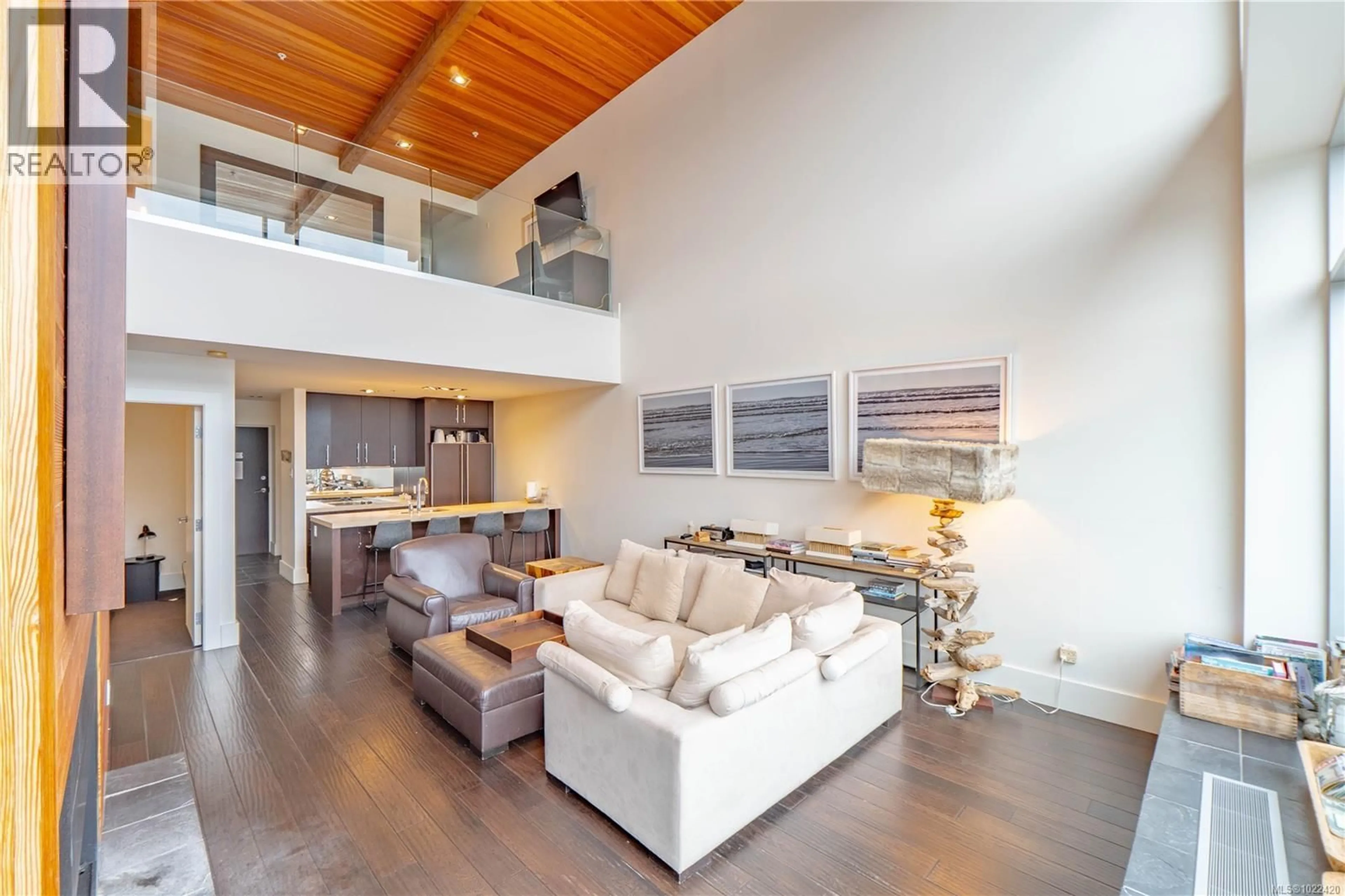 Living room with furniture, wood/laminate floor for 304 - 368 MAIN STREET, Tofino British Columbia V0R2Z0