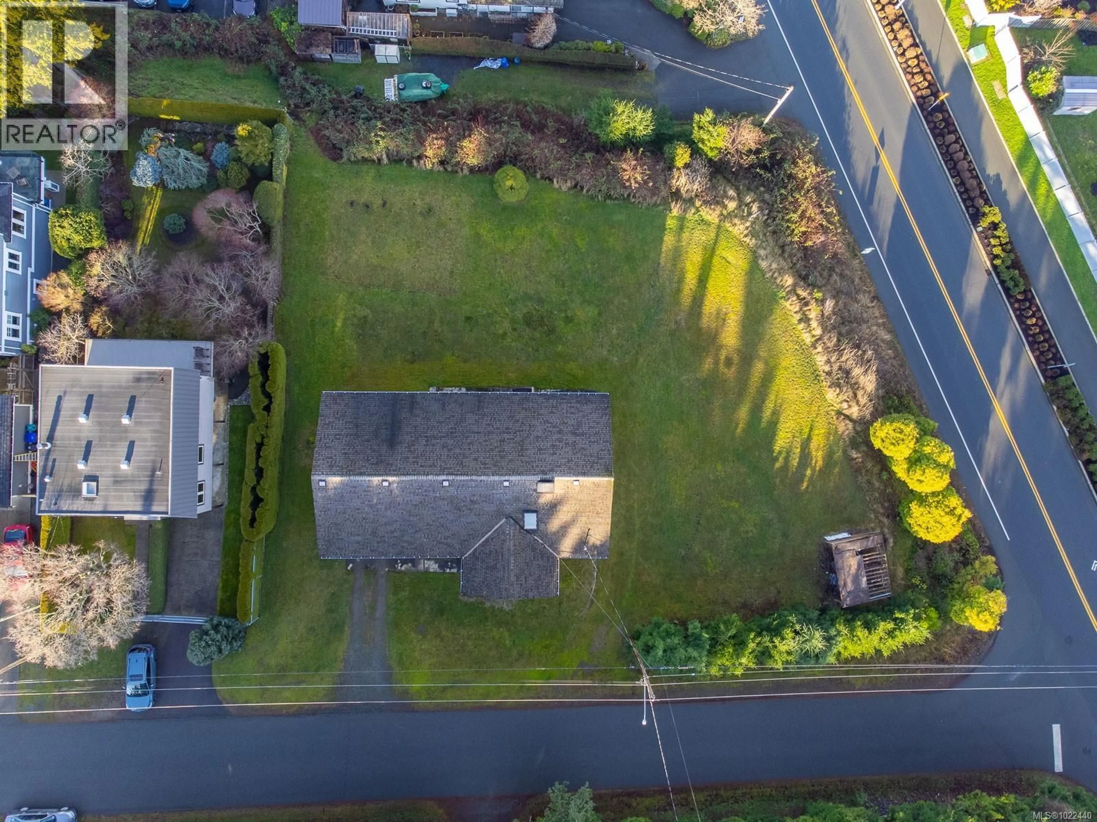 A pic from outside/outdoor area/front of a property/back of a property/a pic from drone, street for 135 SUNNINGDALE ROAD WEST, Qualicum Beach British Columbia V9K1K7