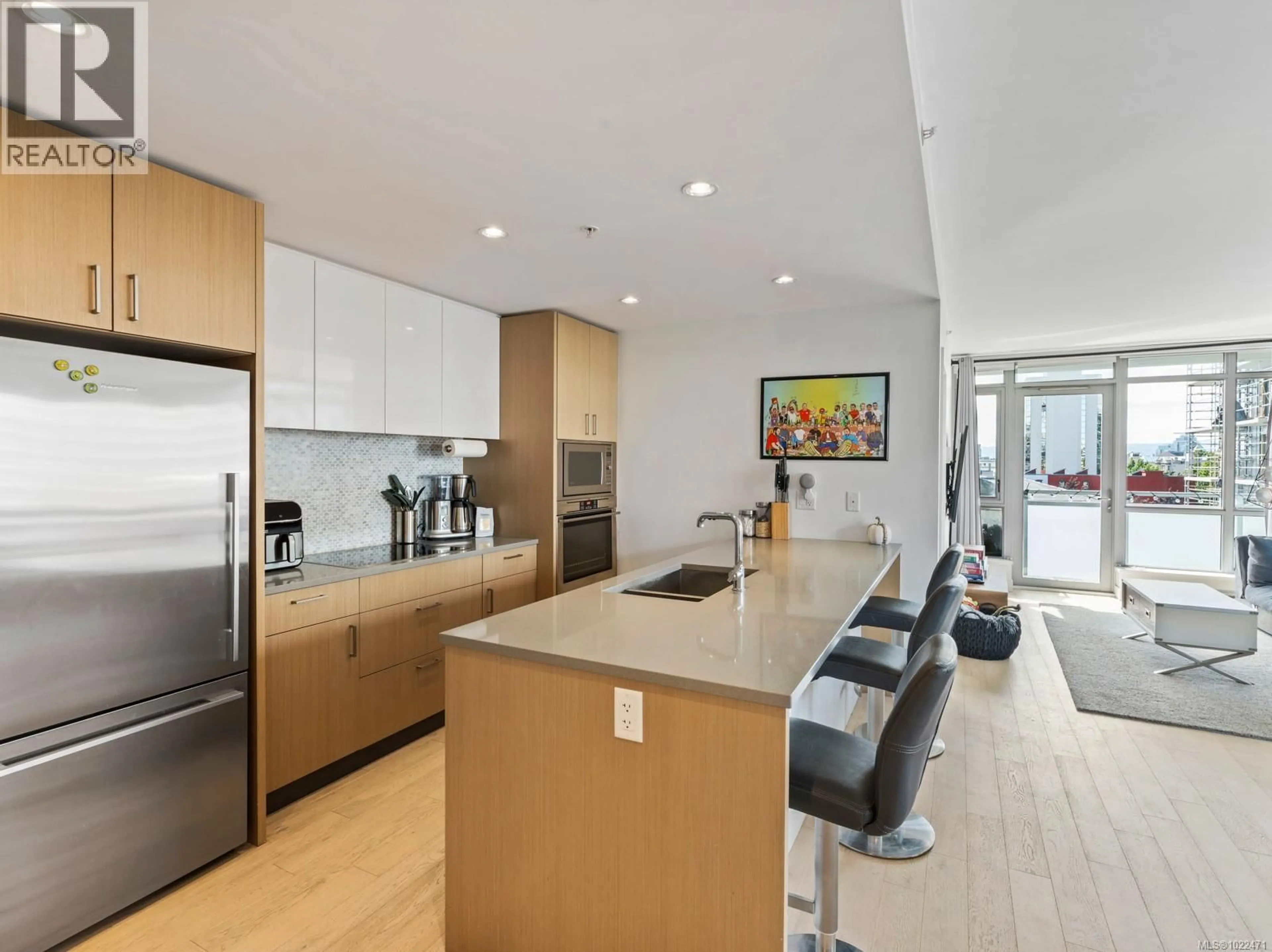 Open concept kitchen, wood/laminate floor for 502 - 838 BROUGHTON STREET, Victoria British Columbia V8W1E4