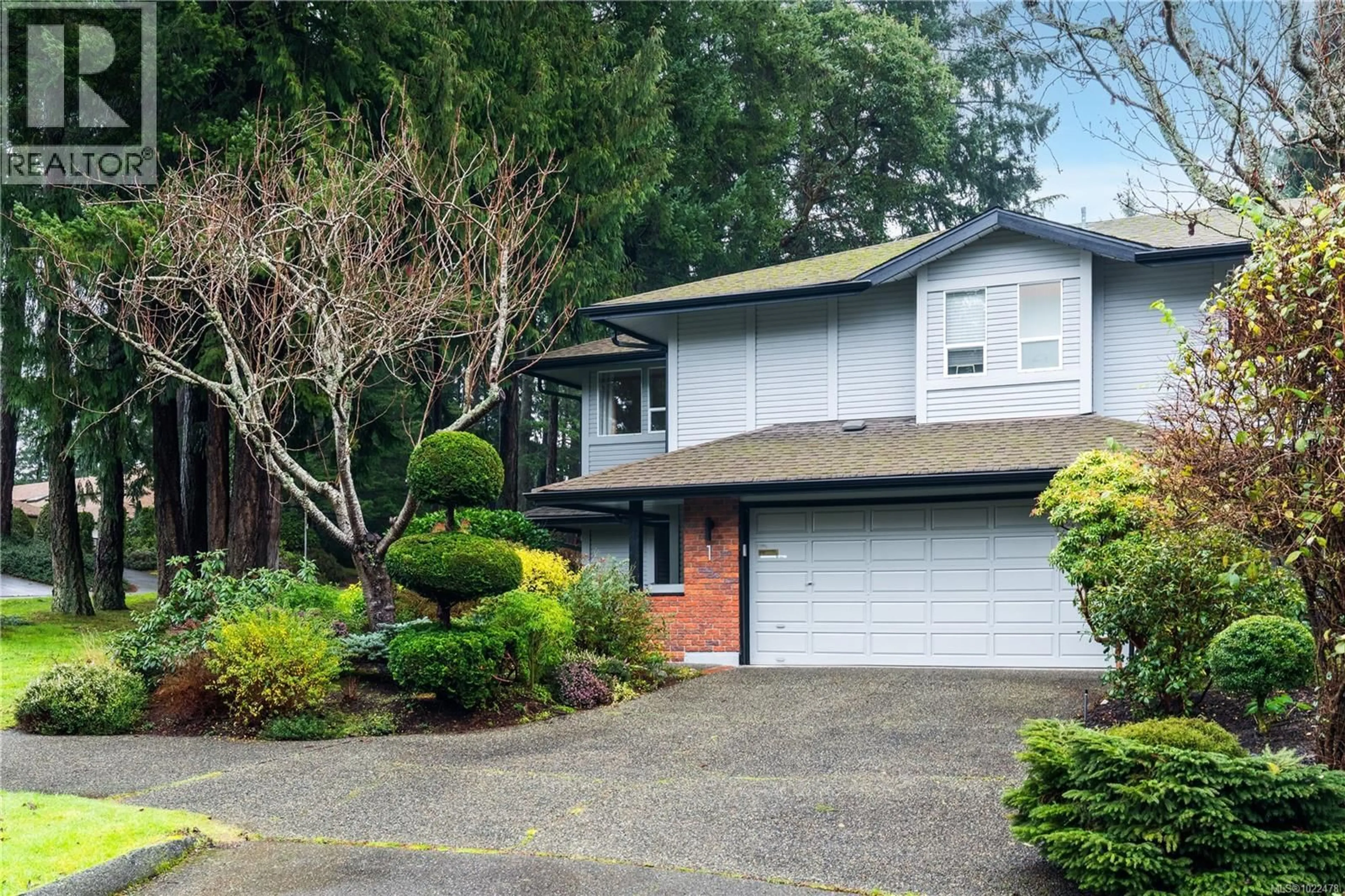 Home with vinyl exterior material, street for 1 - 4630 LOCHSIDE DRIVE, Saanich British Columbia V8Y2T1