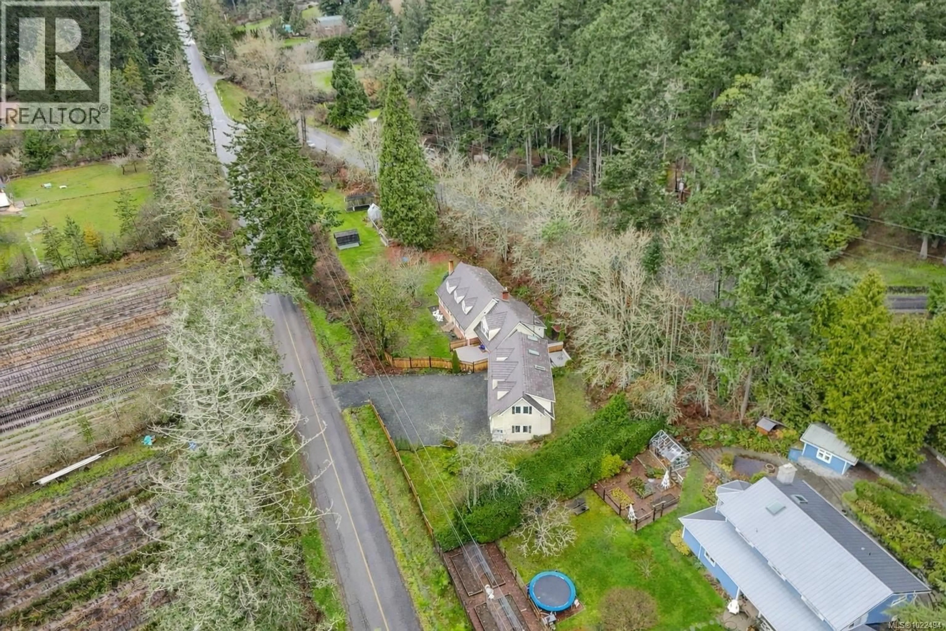 A pic from outside/outdoor area/front of a property/back of a property/a pic from drone, forest/trees view for 1208 TATLOW ROAD, North Saanich British Columbia V8L5P3