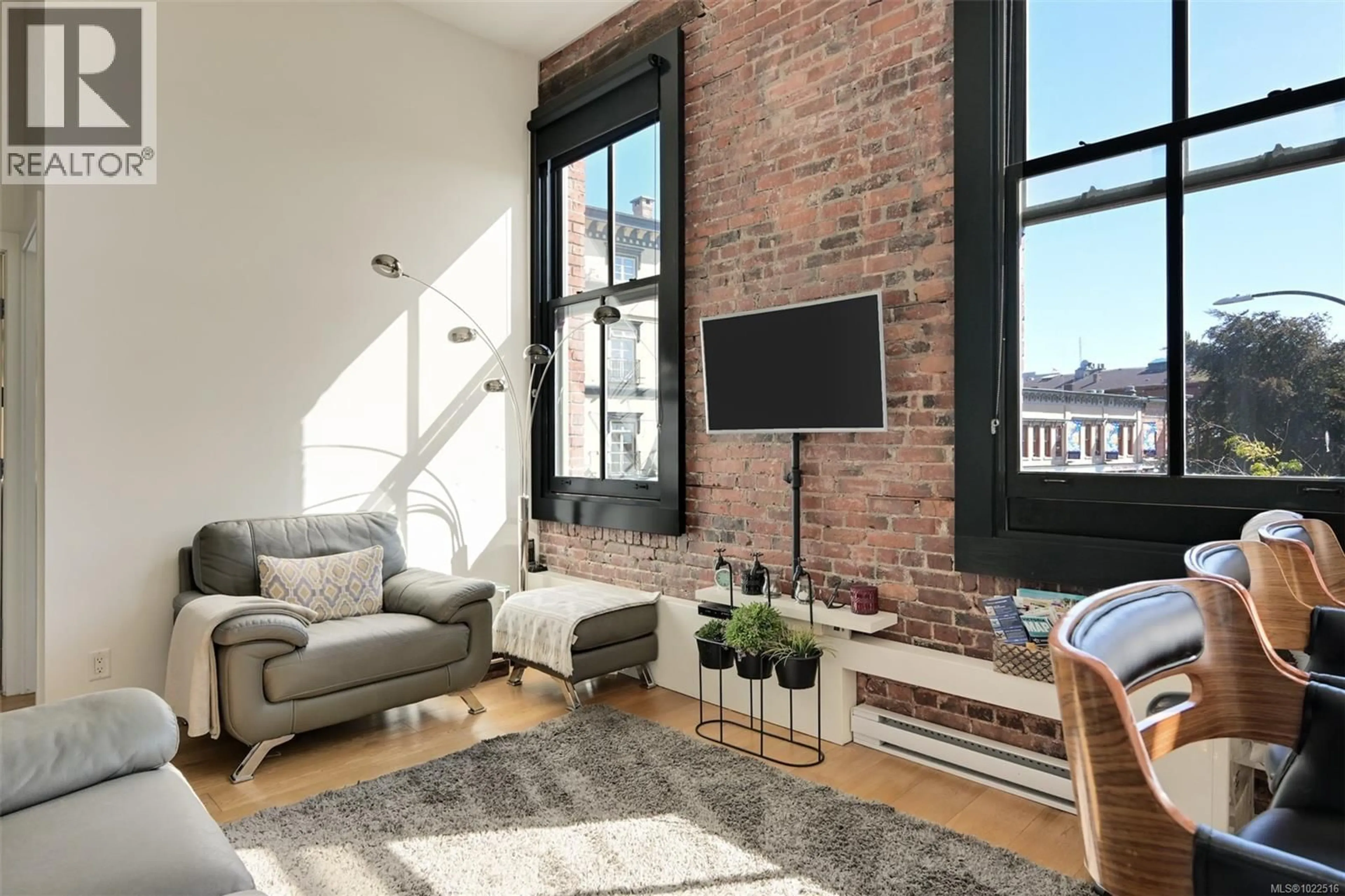 Living room with furniture, cement floor for 225 - 1610 STORE STREET, Victoria British Columbia V8W0E3