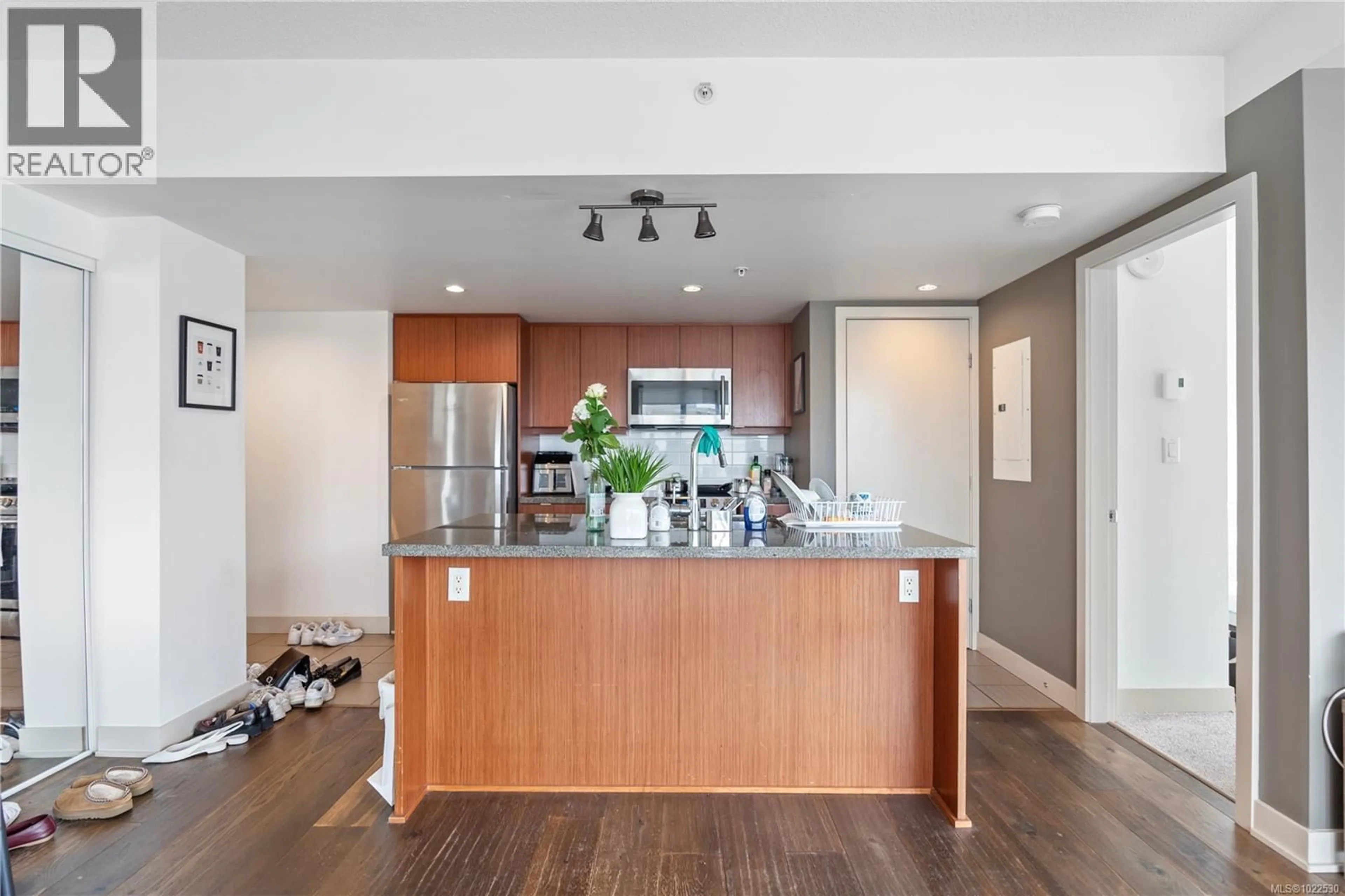 Open concept kitchen, wood/laminate floor for 701 - 760 JOHNSON STREET, Victoria British Columbia V8W1N1
