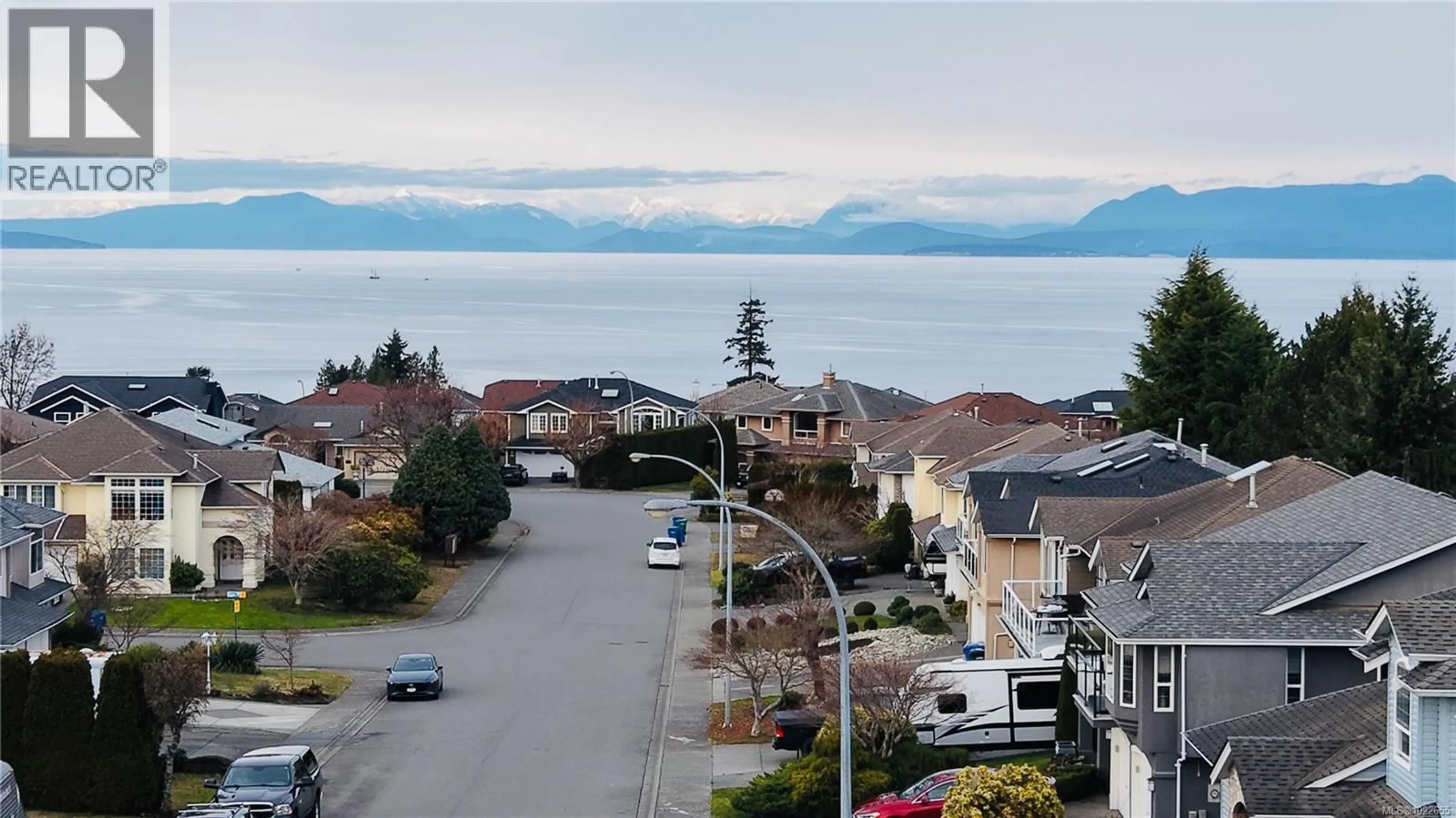 A pic from outside/outdoor area/front of a property/back of a property/a pic from drone, mountain view for 6404 LASALLE ROAD, Nanaimo British Columbia V9V1N6