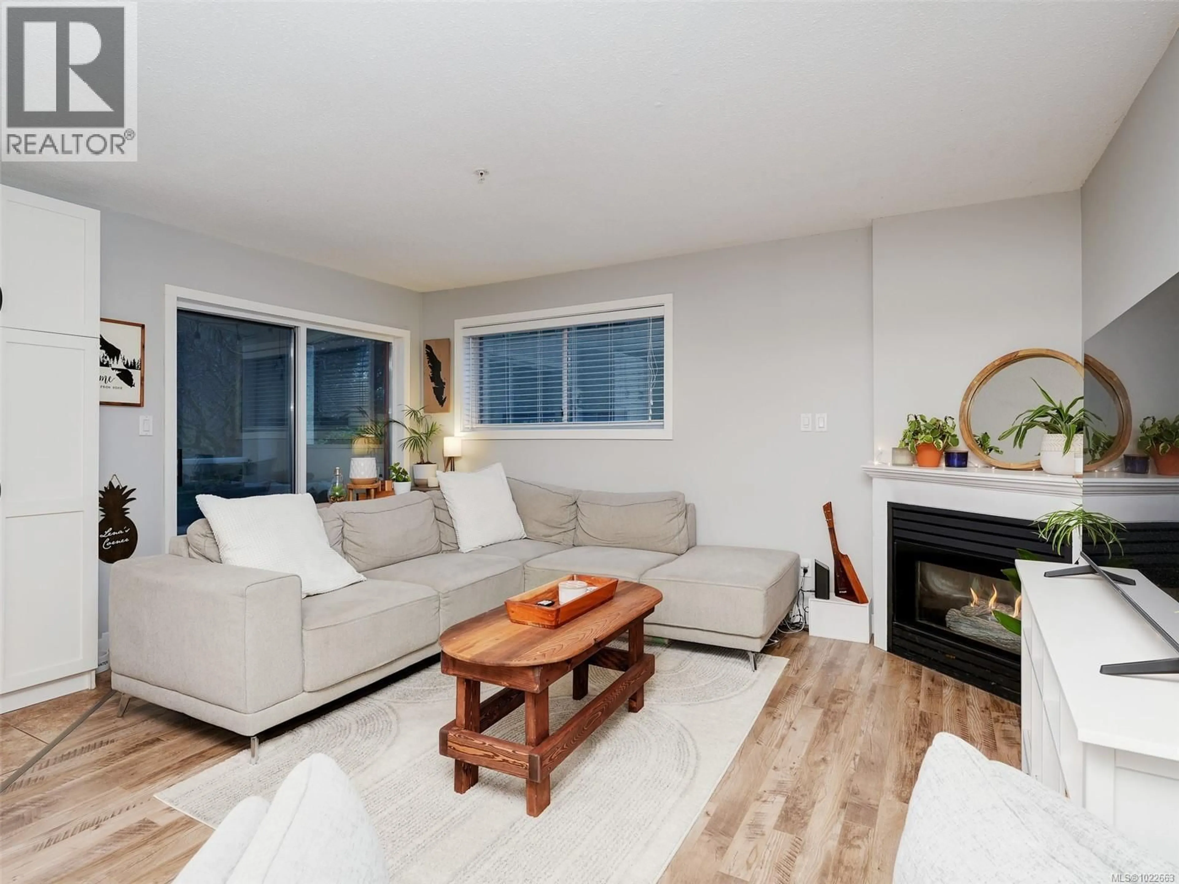 Living room with furniture, wood/laminate floor for 106 - 873 ESQUIMALT ROAD, Esquimalt British Columbia V9A3M5