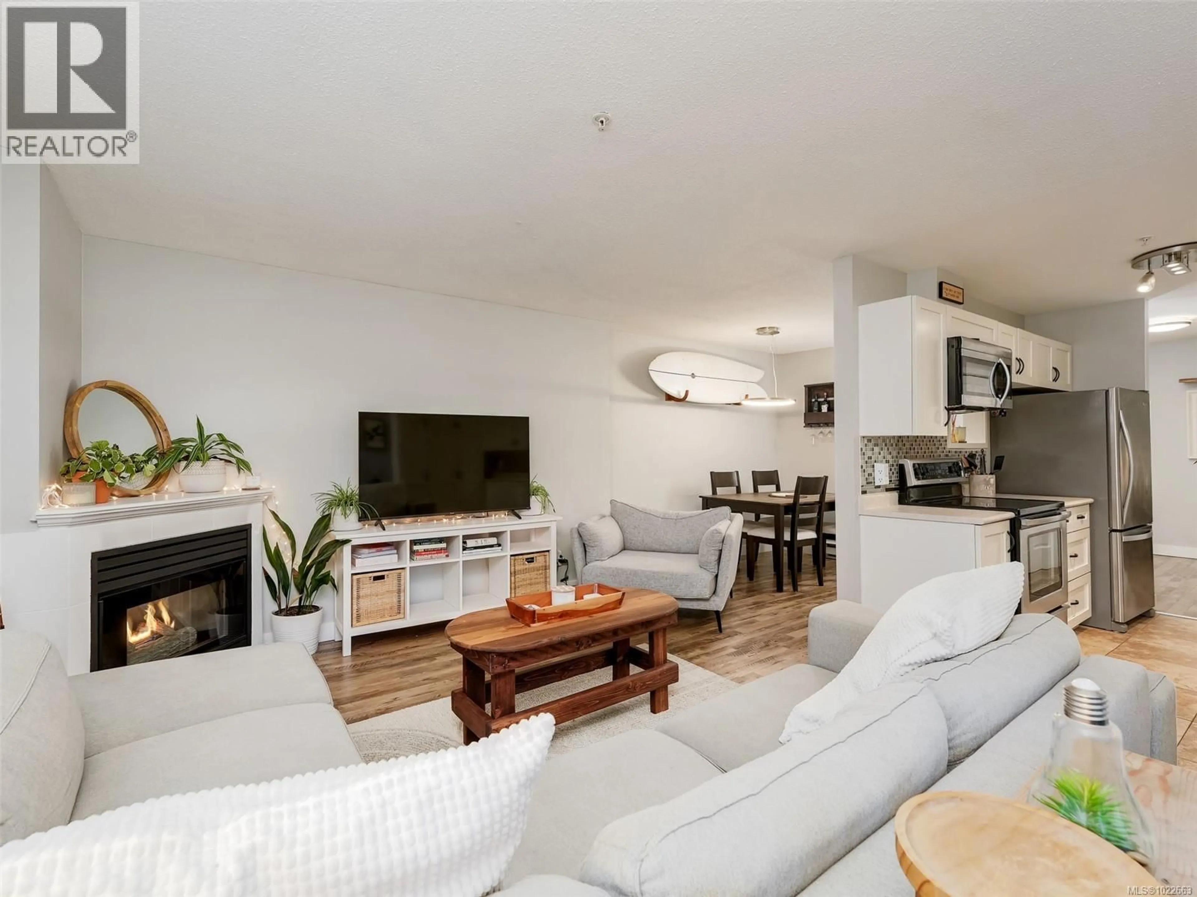 Living room with furniture, wood/laminate floor for 106 - 873 ESQUIMALT ROAD, Esquimalt British Columbia V9A3M5