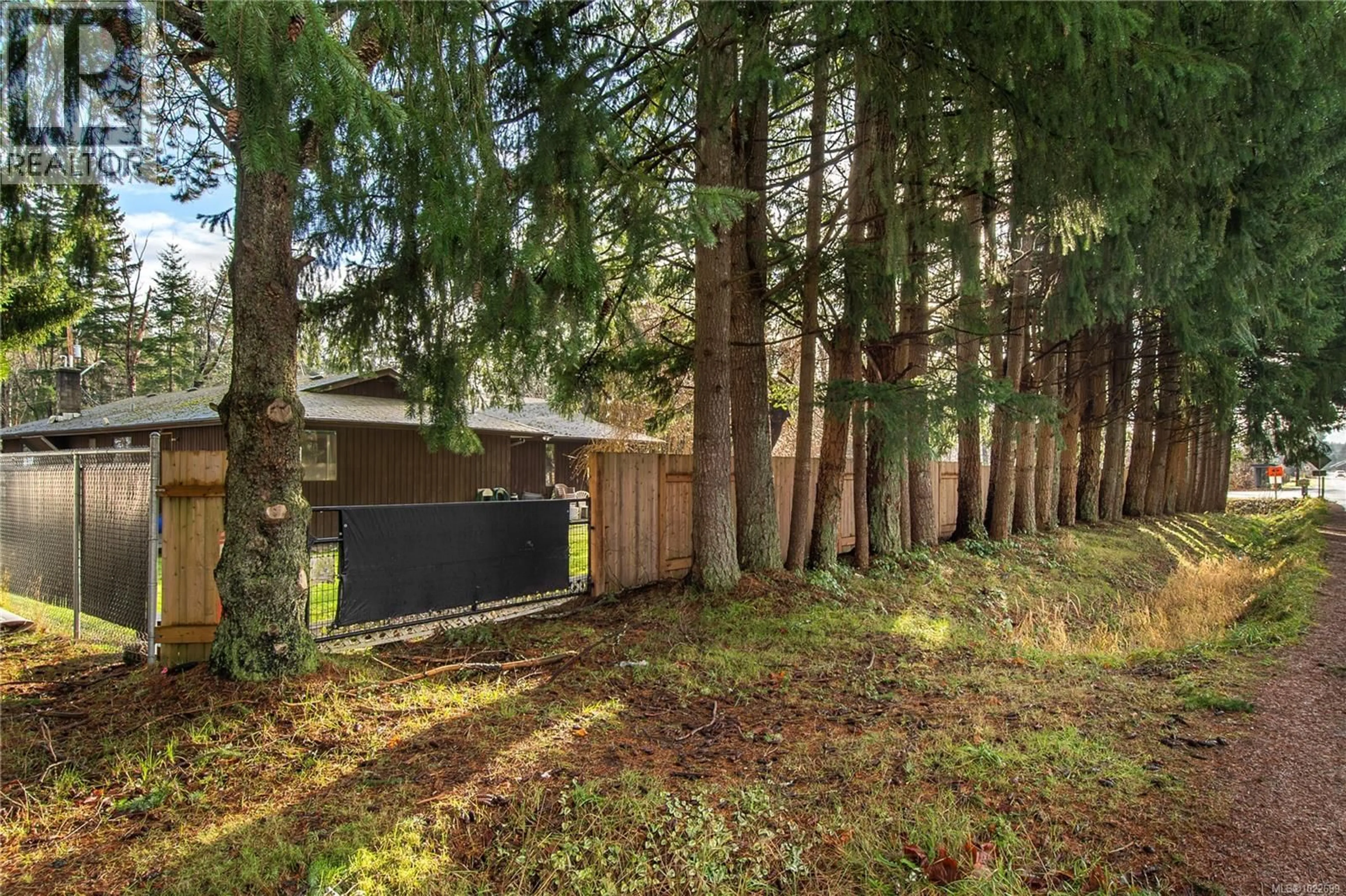 A pic from outside/outdoor area/front of a property/back of a property/a pic from drone, forest/trees view for 450 OLD PETERSEN ROAD, Campbell River British Columbia V9W3M9