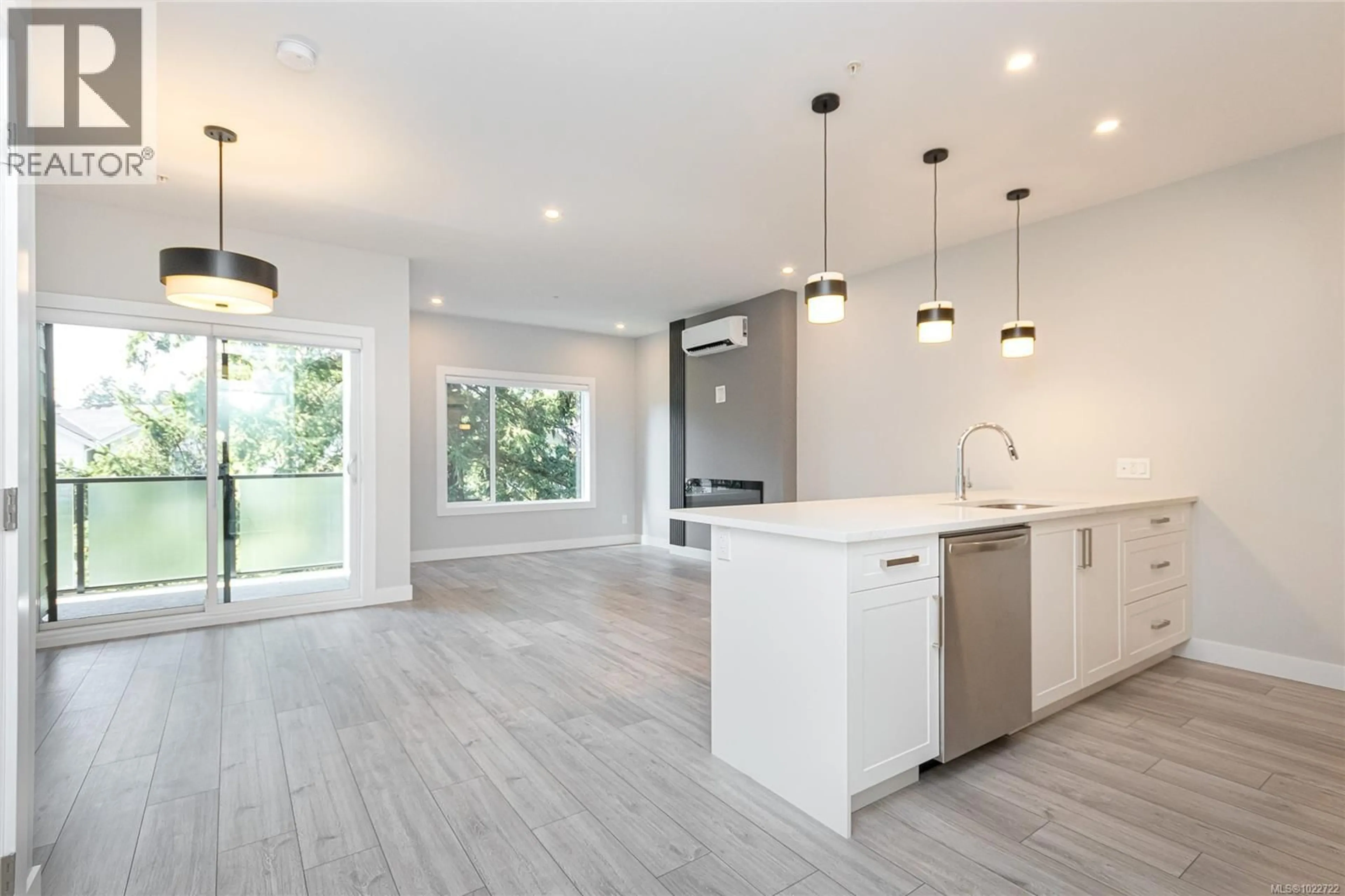 Open concept kitchen, wood/laminate floor for 305 - 924 JENKINS AVENUE, Langford British Columbia V9B2N7