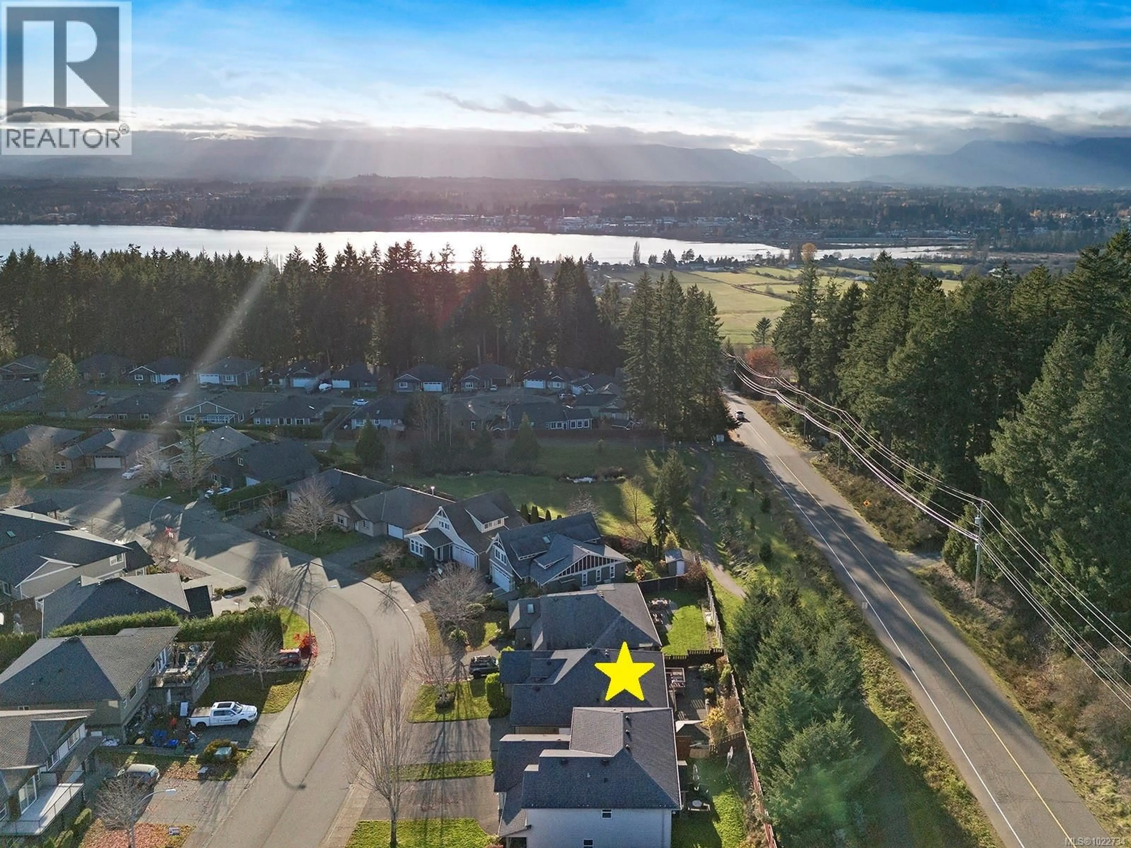A pic from outside/outdoor area/front of a property/back of a property/a pic from drone, water/lake/river/ocean view for 2454 AVRO ARROW DRIVE, Comox British Columbia V9M0A6
