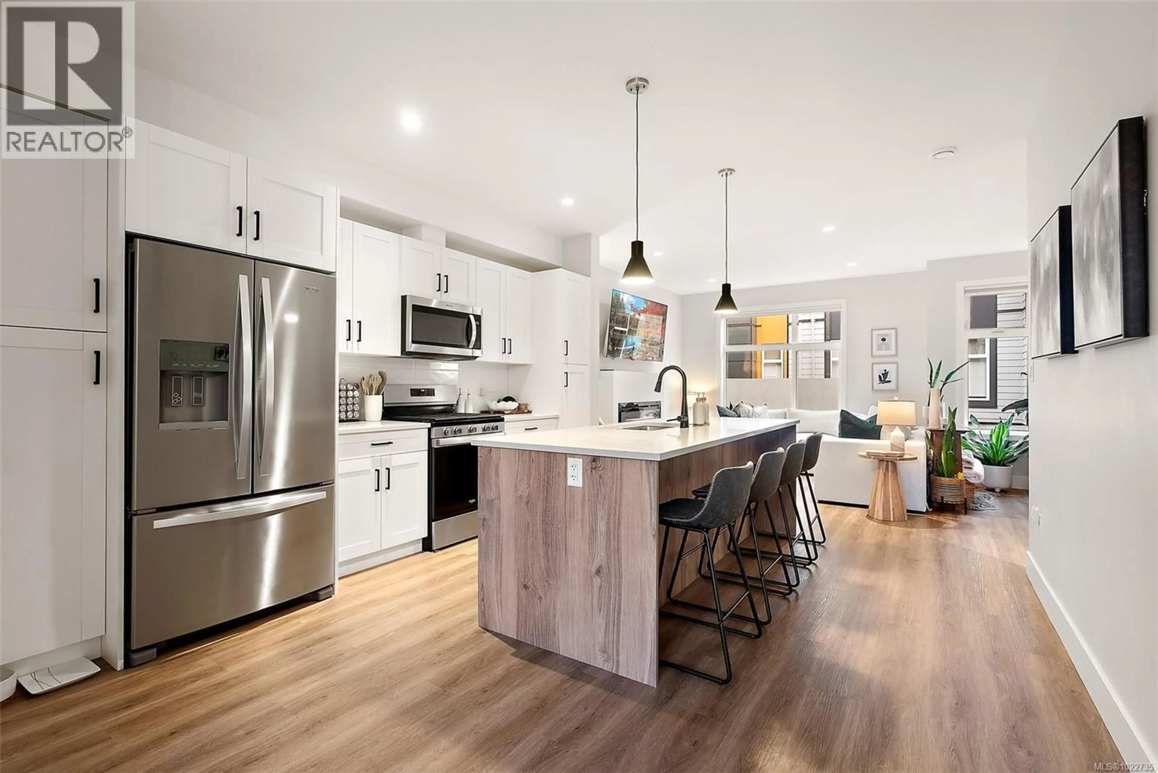 Open concept kitchen, wood/laminate floor for 108 - 2130 TRIANGLE TRAIL, Langford British Columbia V9C0R2