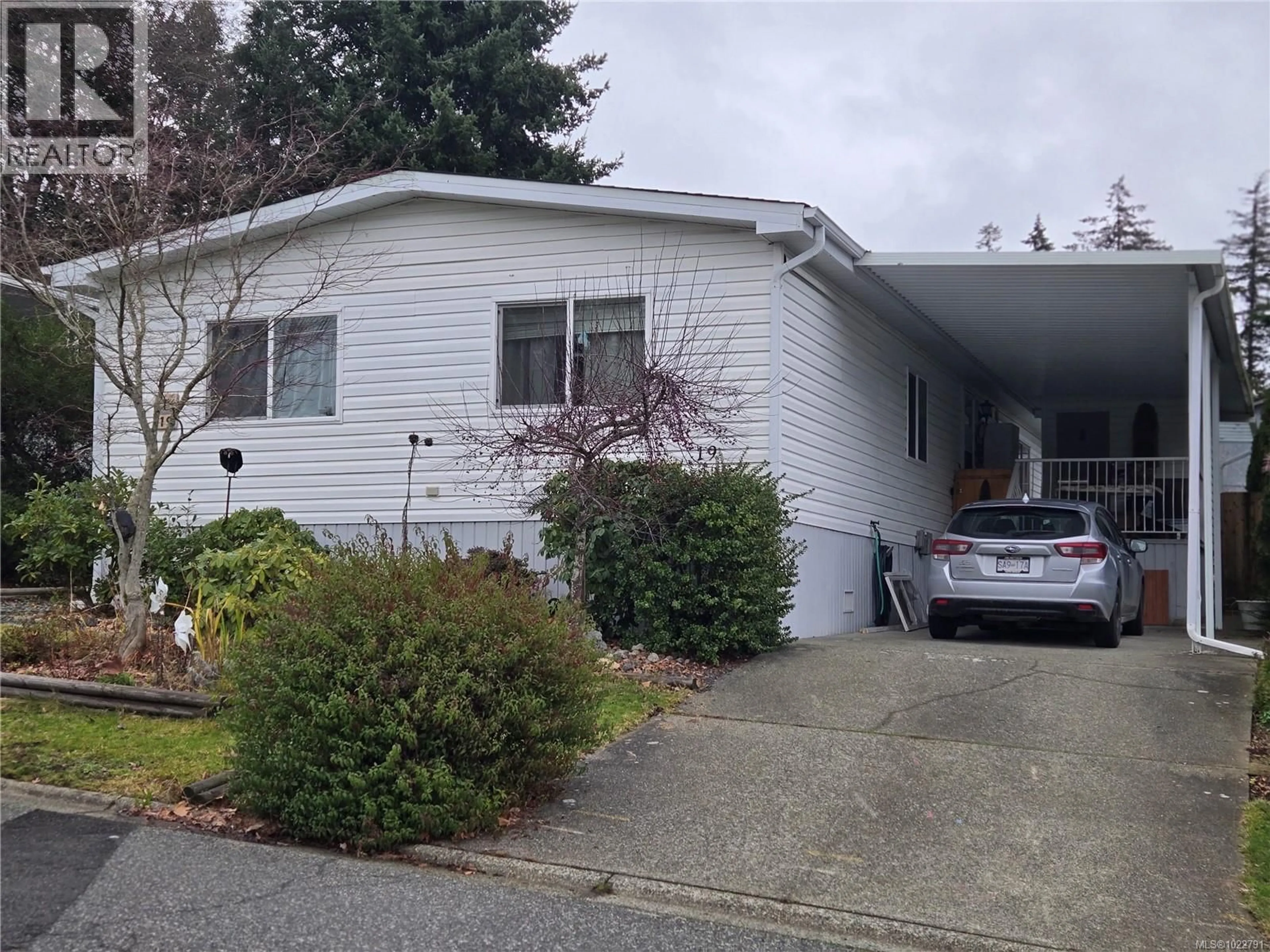 Home with vinyl exterior material, street for 19 - 2501 LABIEUX ROAD, Nanaimo British Columbia V9T5X3