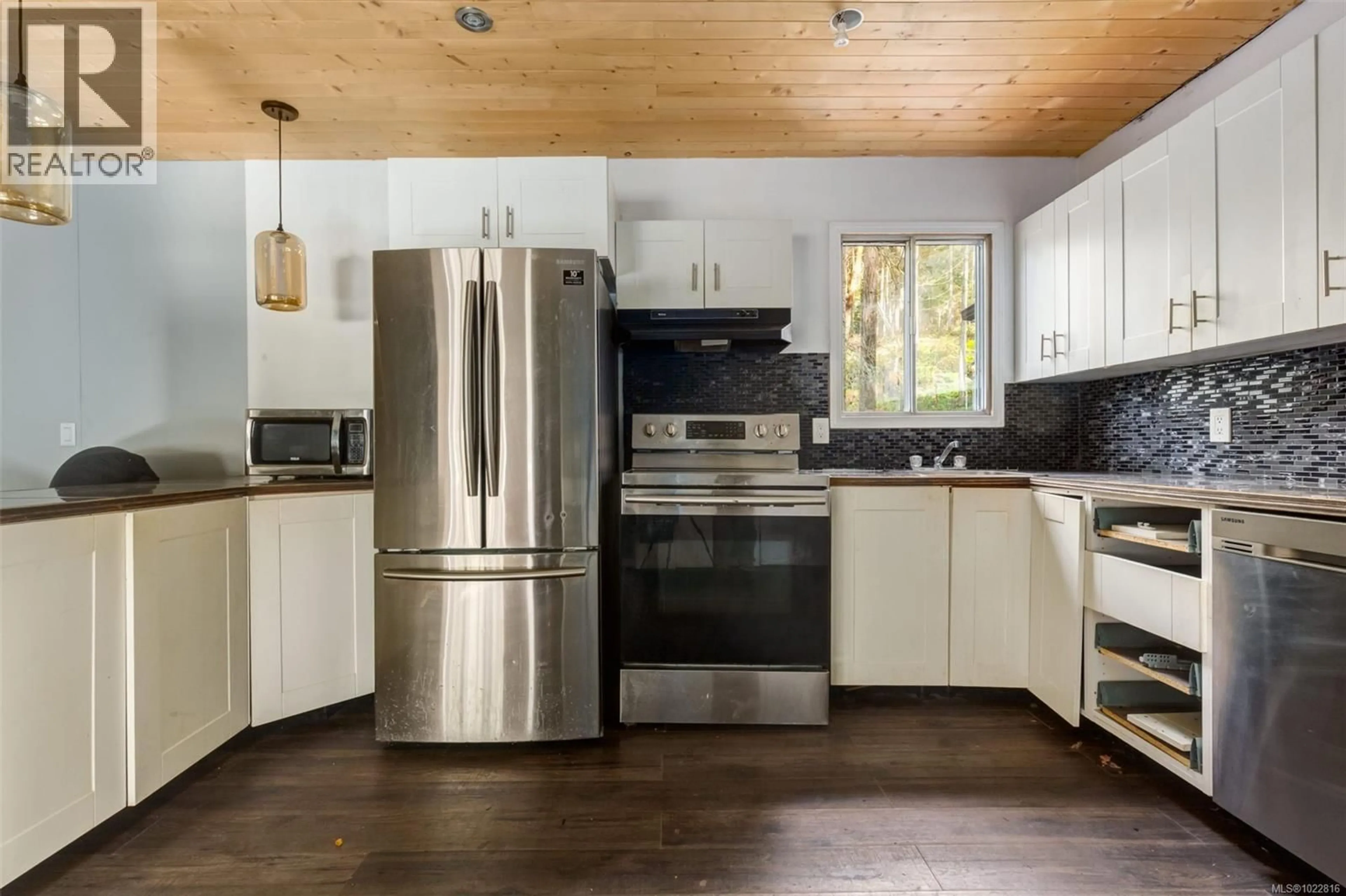 Open concept kitchen, wood/laminate floor for 1900 MARTIN ROAD, Gabriola Island British Columbia V0R1X7