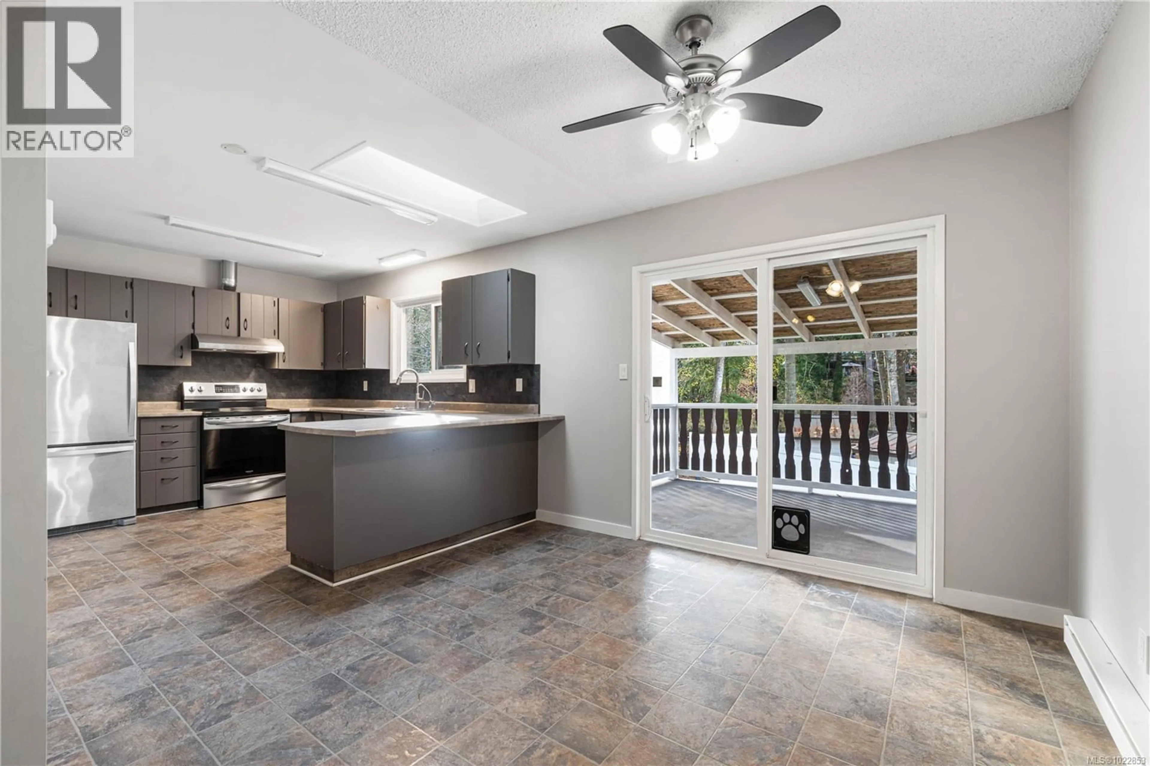 Open concept kitchen, ceramic/tile floor for 2675 LABIEUX ROAD, Nanaimo British Columbia V9T3N3