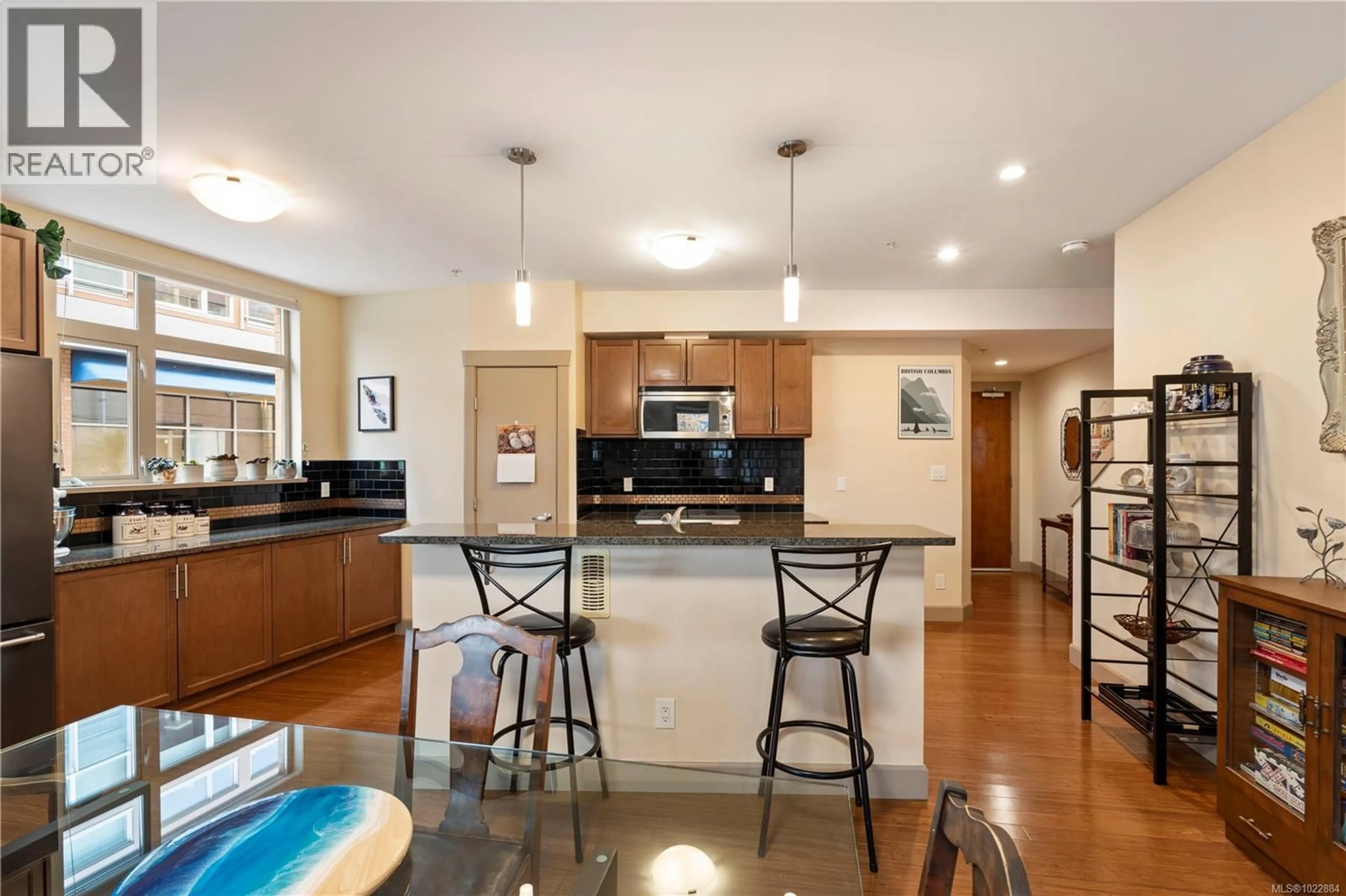 Open concept kitchen, ceramic/tile floor for 105 - 1035 SUTLEJ STREET, Victoria British Columbia V8V2V9